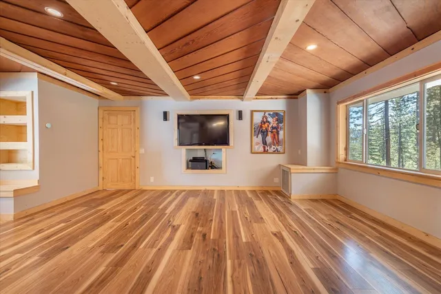 a bedroom with bed and a window