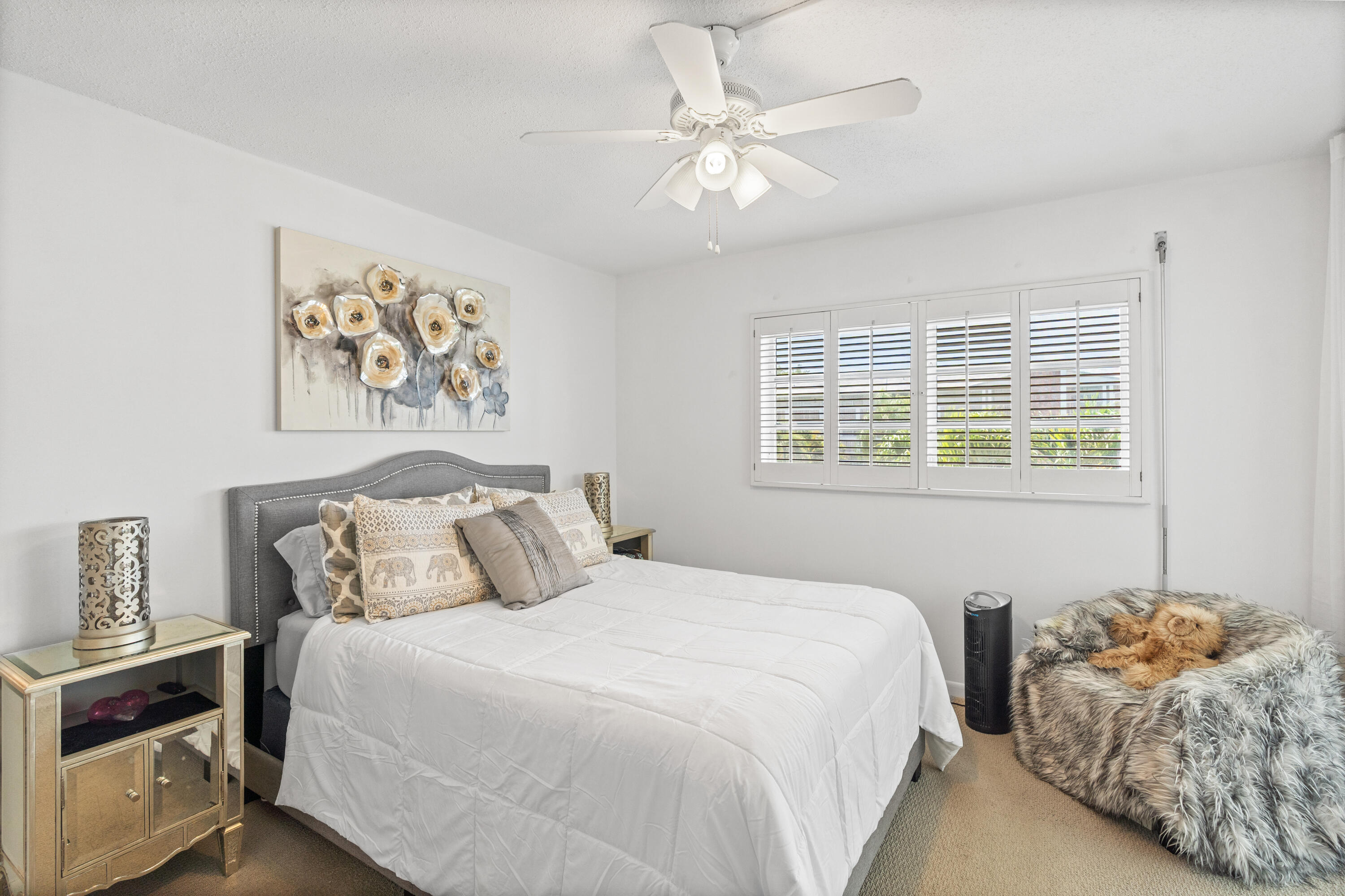 25 Southeast 13th Street, Unit B3 Boca Raton, FL 33432 - Photo 15 of 26 a bedroom with a bed and a window