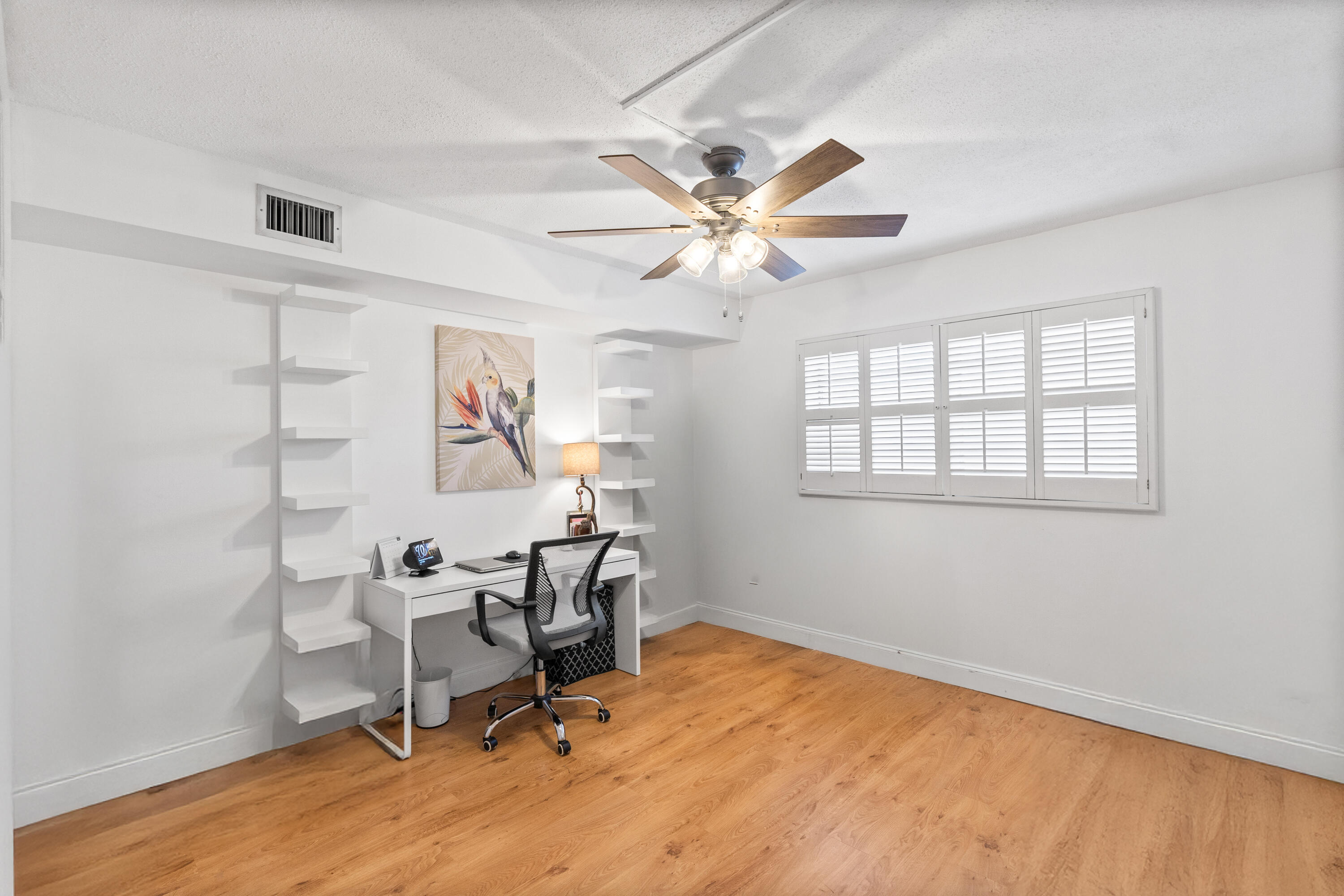 25 Southeast 13th Street, Unit B3 Boca Raton, FL 33432 - Photo 19 of 26 a view of a workspace with furniture and a window