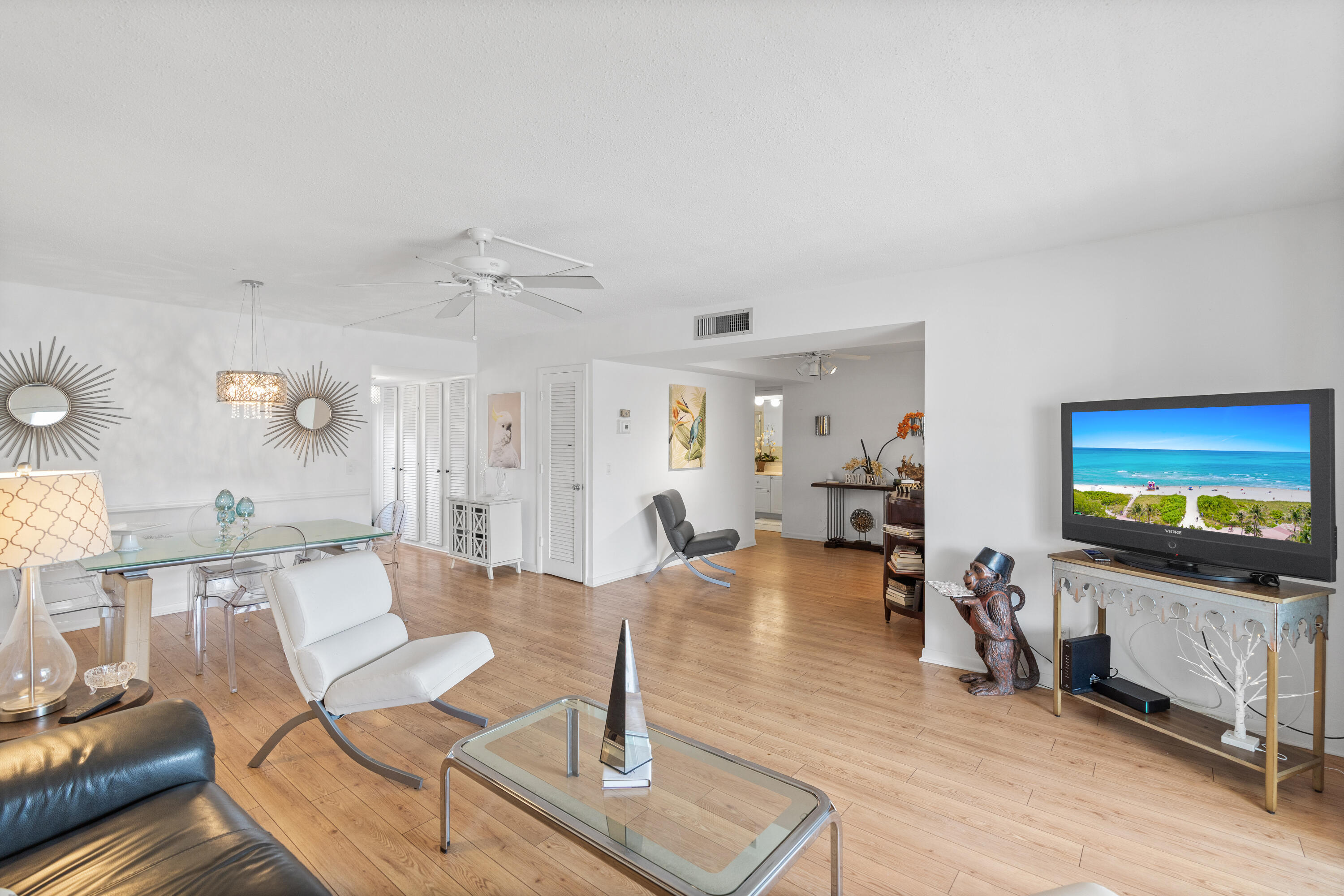 25 Southeast 13th Street, Unit B3 Boca Raton, FL 33432 - Photo 4 of 26 a living room with furniture and a flat screen tv