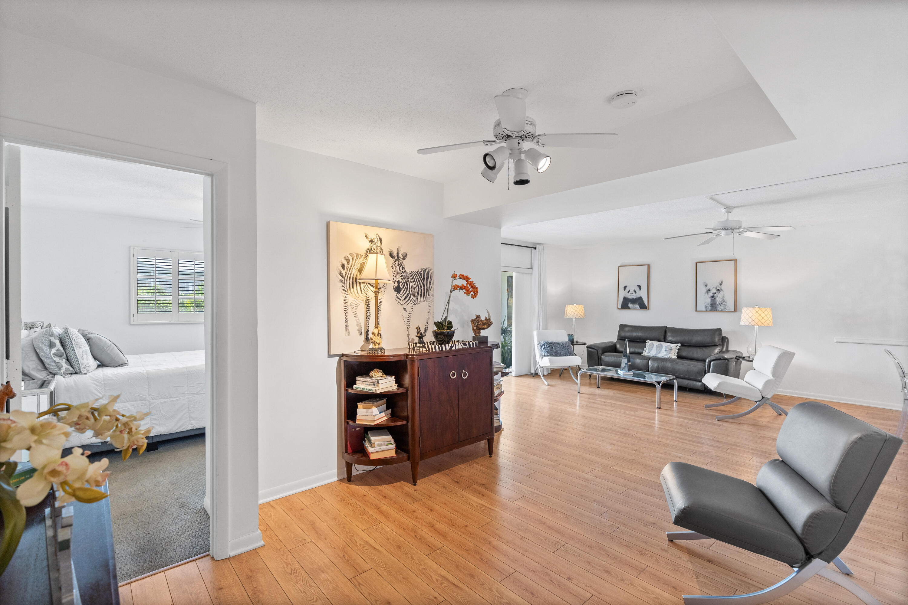 25 Southeast 13th Street, Unit B3 Boca Raton, FL 33432 - Photo 8 of 26 a living room with furniture and wooden floor
