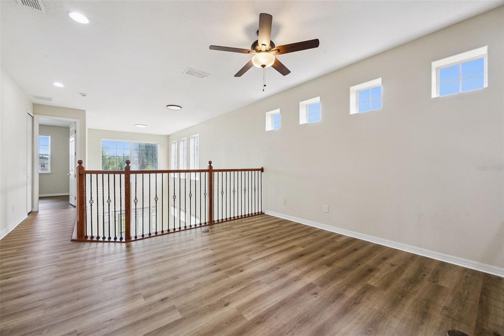 551 Terrace Spring Drive Orlando, FL 32828 - Photo 20 of 41 a view of a hallway with wooden floor