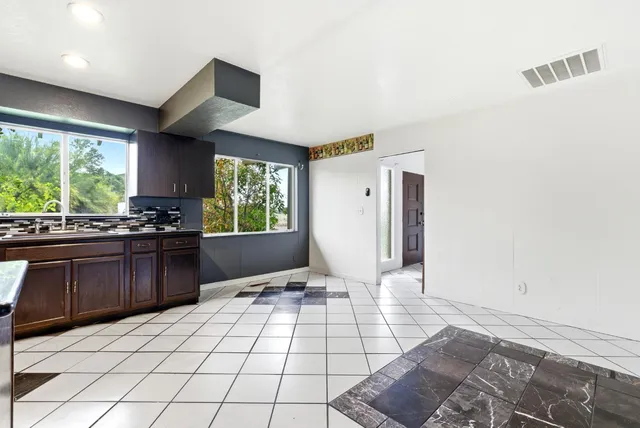 a view of a kitchen with a sink and a microwave