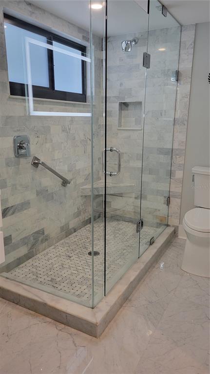 11 Sunset Drive, Unit 704 Sarasota, FL 34236 - Photo 17 of 34 a bathroom with a shower