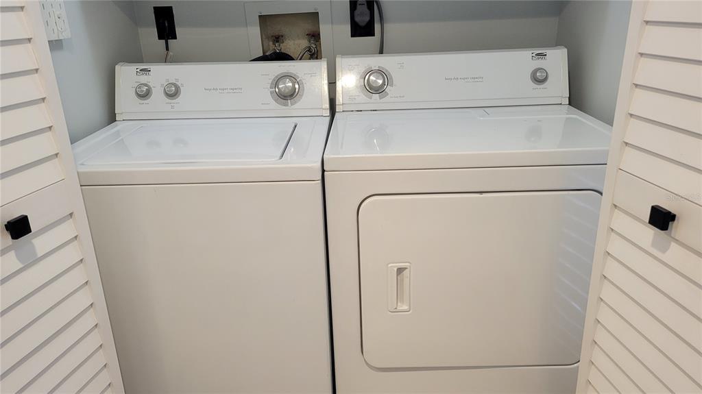 11 Sunset Drive, Unit 704 Sarasota, FL 34236 - Photo 24 of 34 a close up view of a washer and dryer