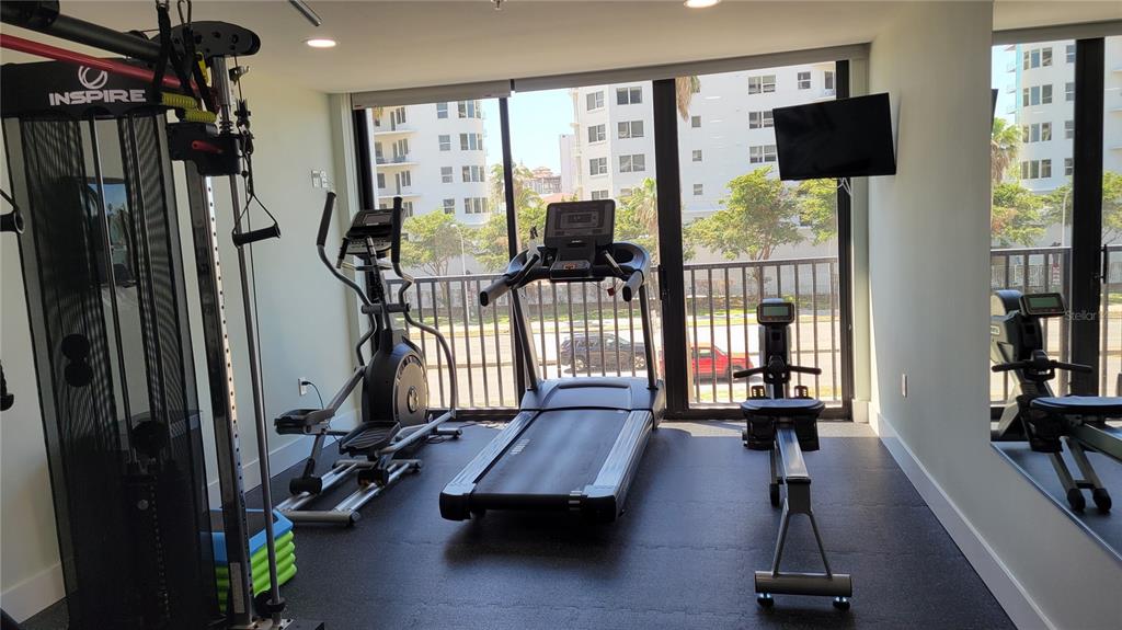 11 Sunset Drive, Unit 704 Sarasota, FL 34236 - Photo 33 of 34 a room with gym equipment and a window