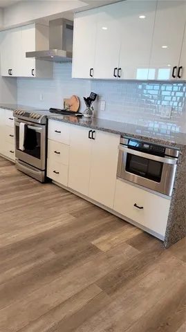 a kitchen with a stove and a sink