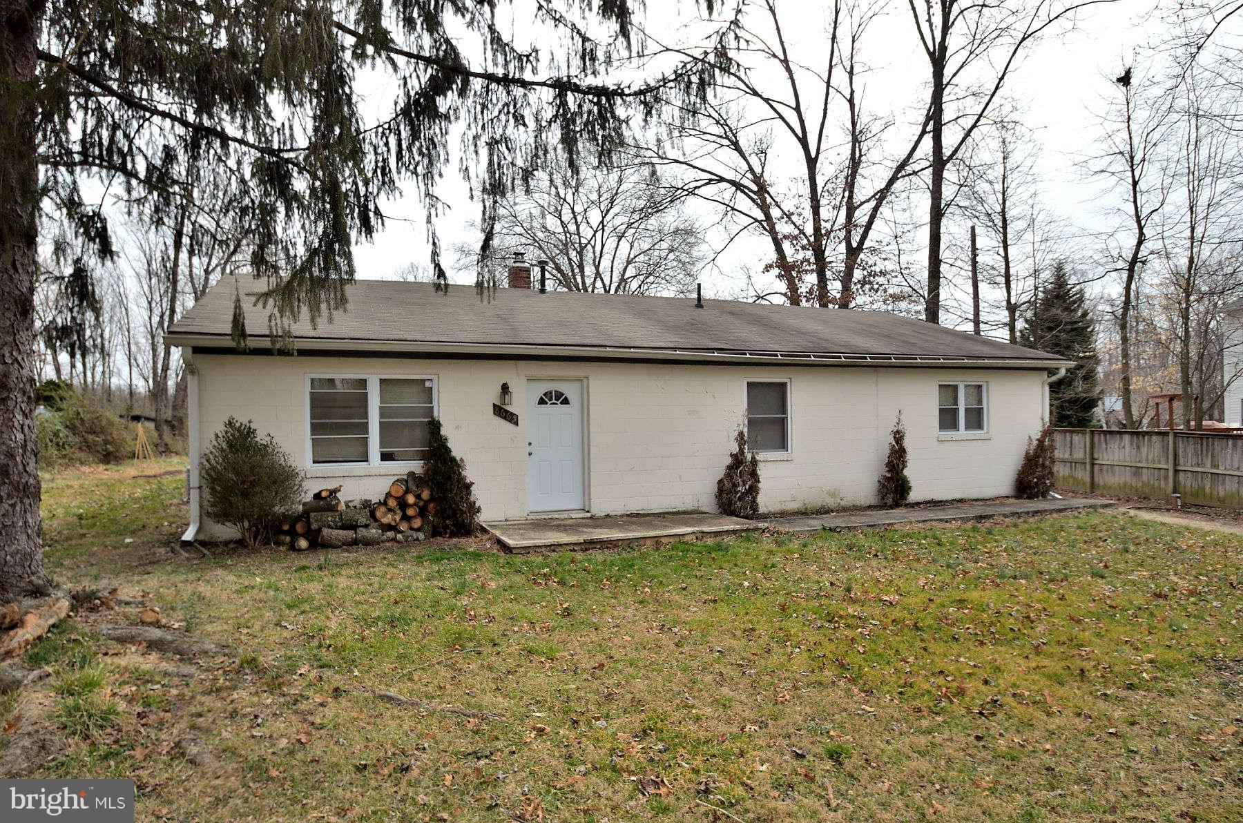 8665 Center Road, Unit 1 Springfield, VA 22152 - Photo 1 of 2 a view of a house with a yard
