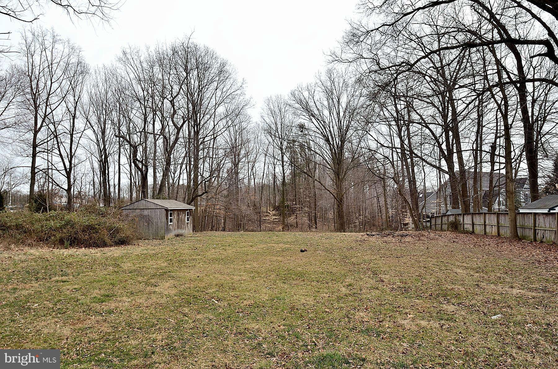 8665 Center Road, Unit 1 Springfield, VA 22152 - Photo 2 of 2 a view of white house with a yard