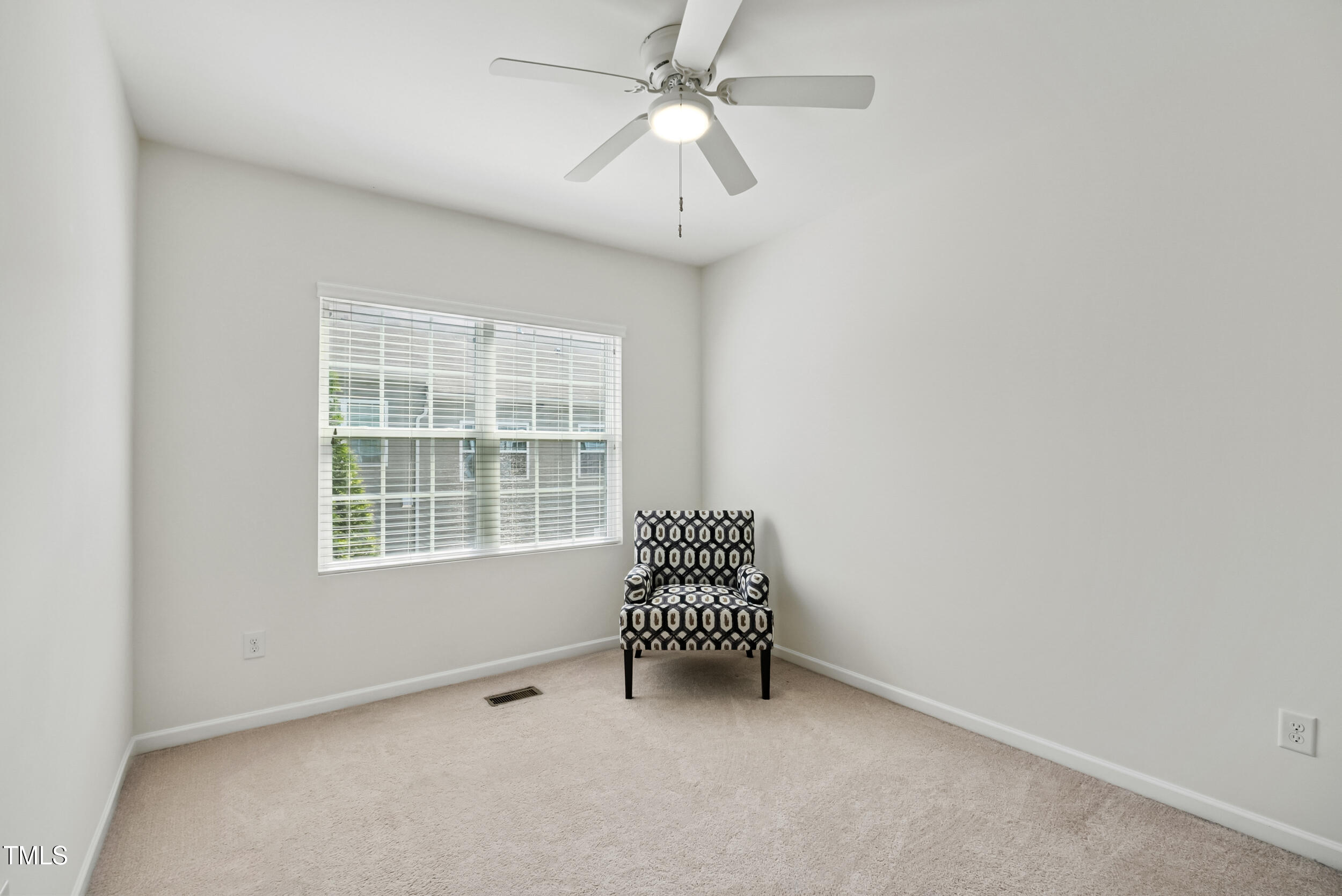 16 Daly Court Durham, NC 27705 - Photo 22 of 35 an empty room with a window and a fan