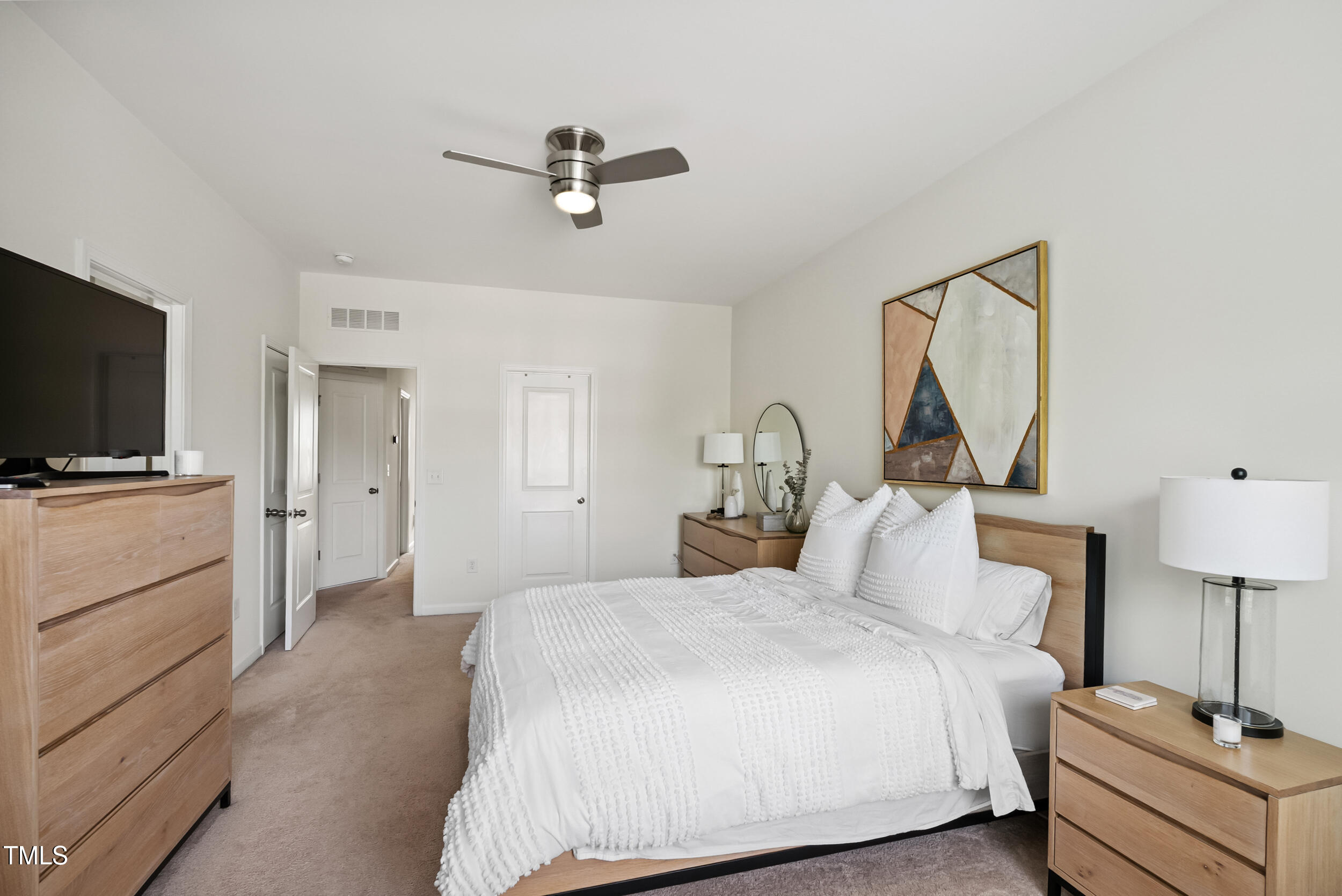 16 Daly Court Durham, NC 27705 - Photo 25 of 35 a bedroom with a bed and a flat screen tv