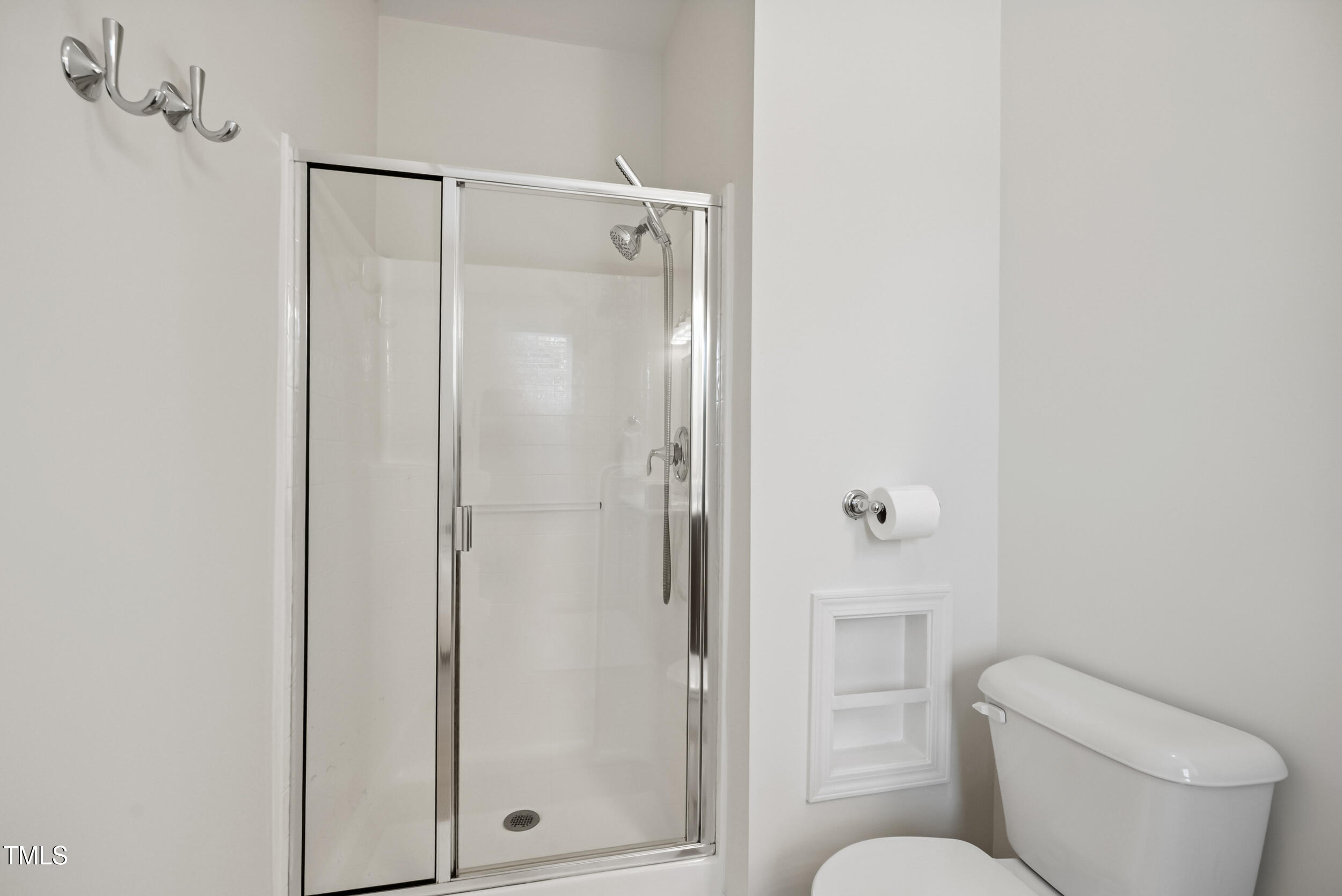 16 Daly Court Durham, NC 27705 - Photo 28 of 35 a bathroom with a toilet and a shower