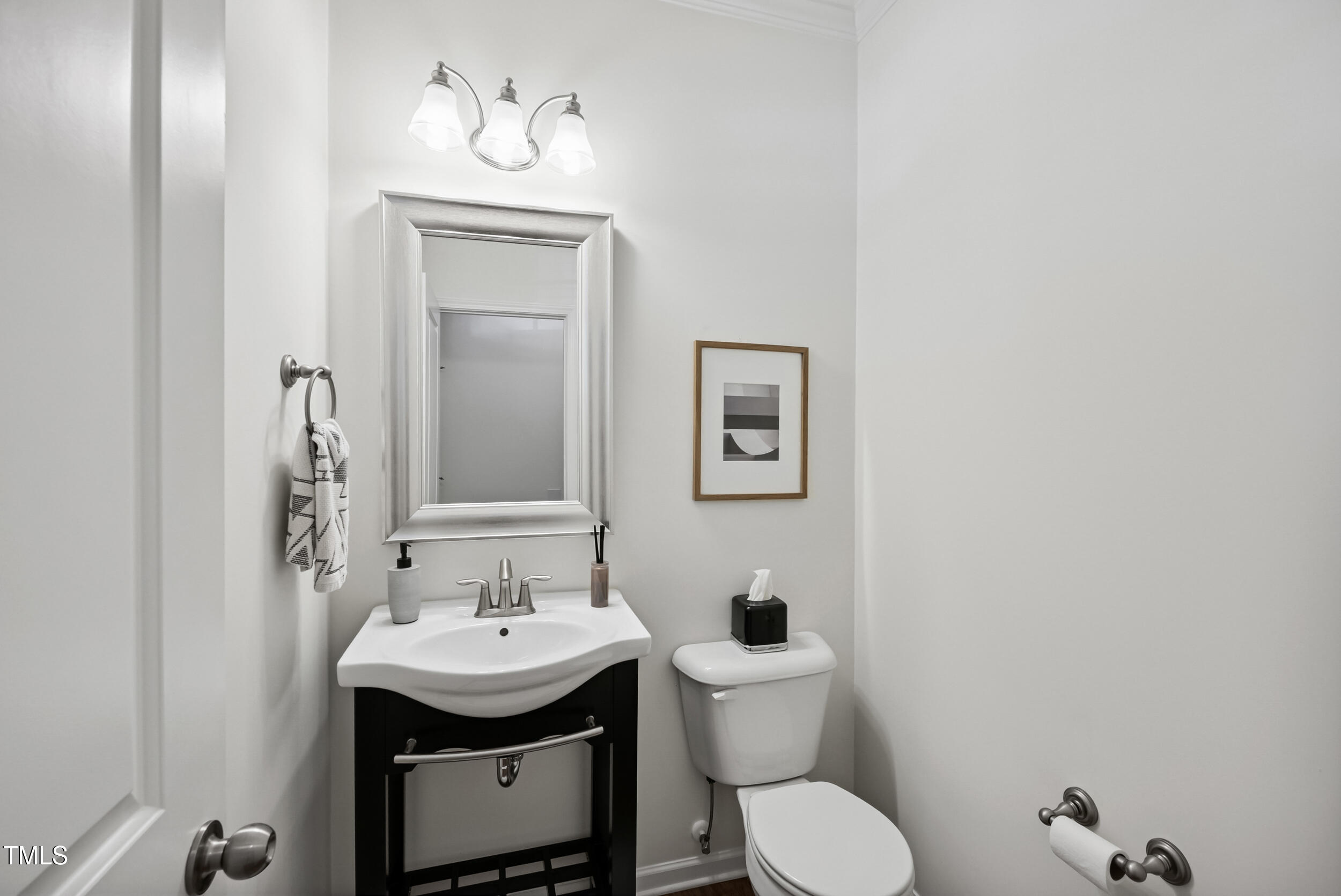 16 Daly Court Durham, NC 27705 - Photo 5 of 35 a bathroom with a toilet sink and mirror