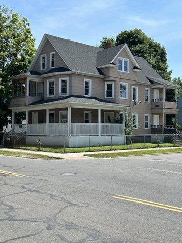 385 Orange Street Springfield, MA 01108 - Photo 1 of 11 a front view of a house with a yard