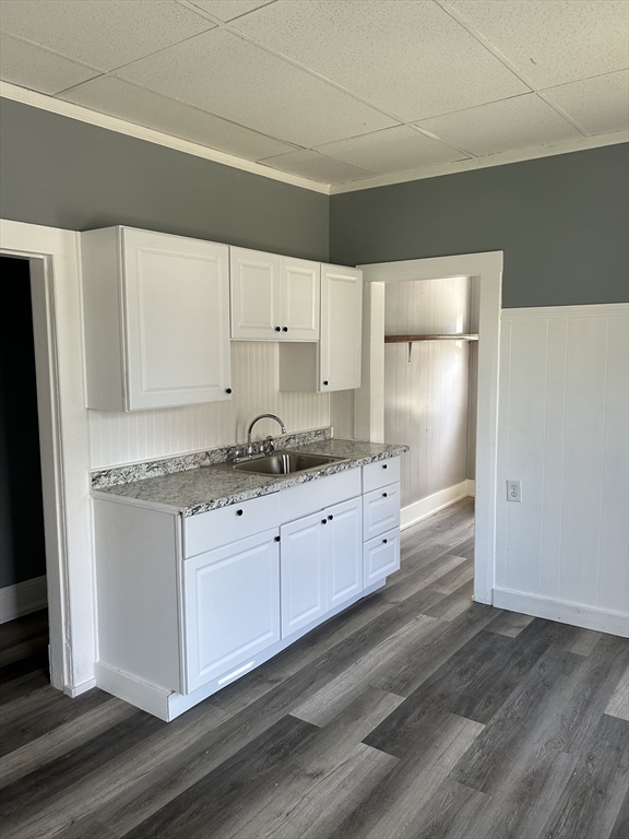 385 Orange Street Springfield, MA 01108 - Photo 5 of 11 a kitchen with granite countertop white cabinets and white appliances