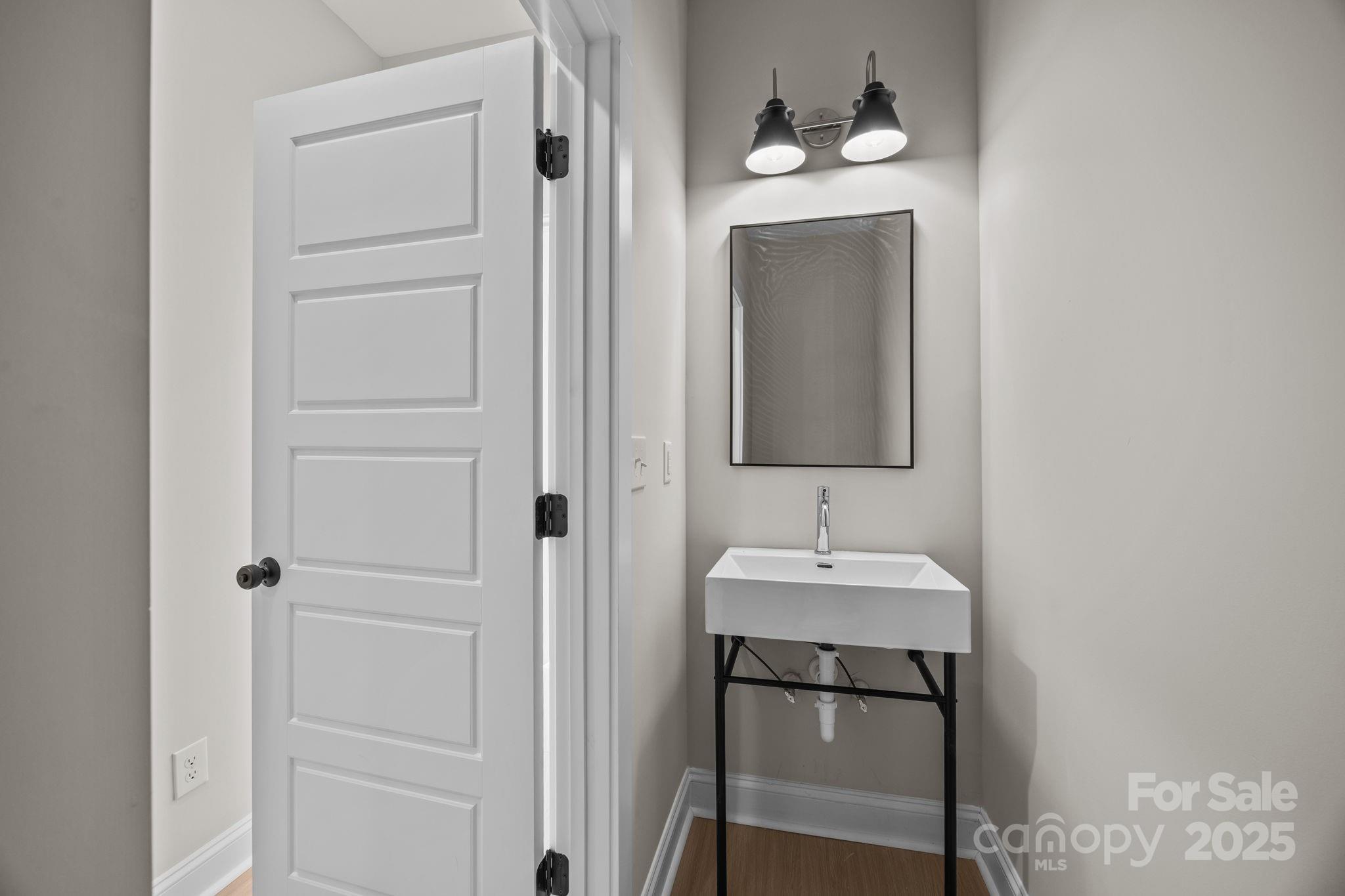 2295 Lee Lawing Road Lincolnton, NC 28092 - Photo 24 of 46 a bathroom with a sink and a mirror