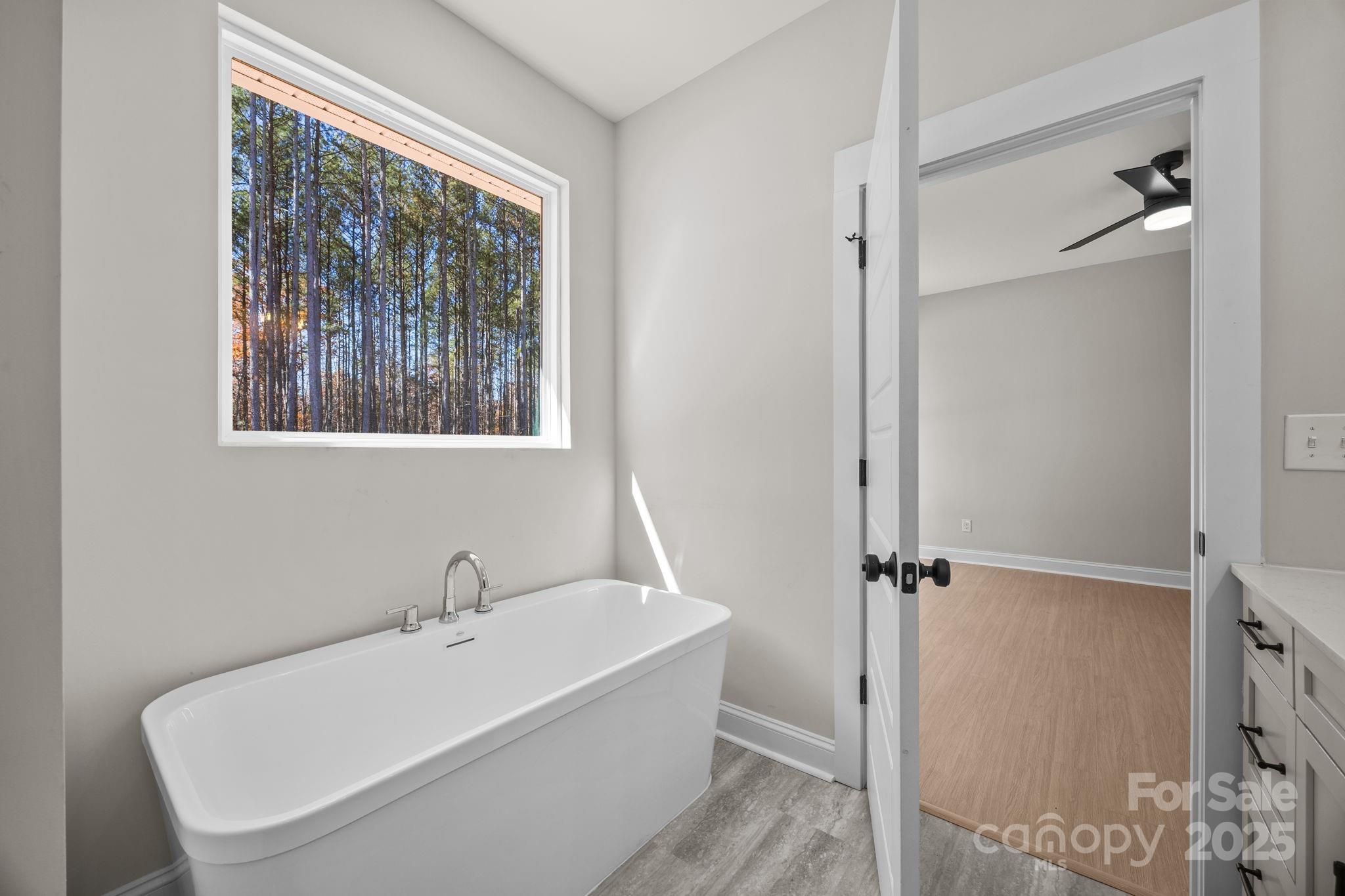 2295 Lee Lawing Road Lincolnton, NC 28092 - Photo 30 of 46 a white bath tub sitting next to a shower