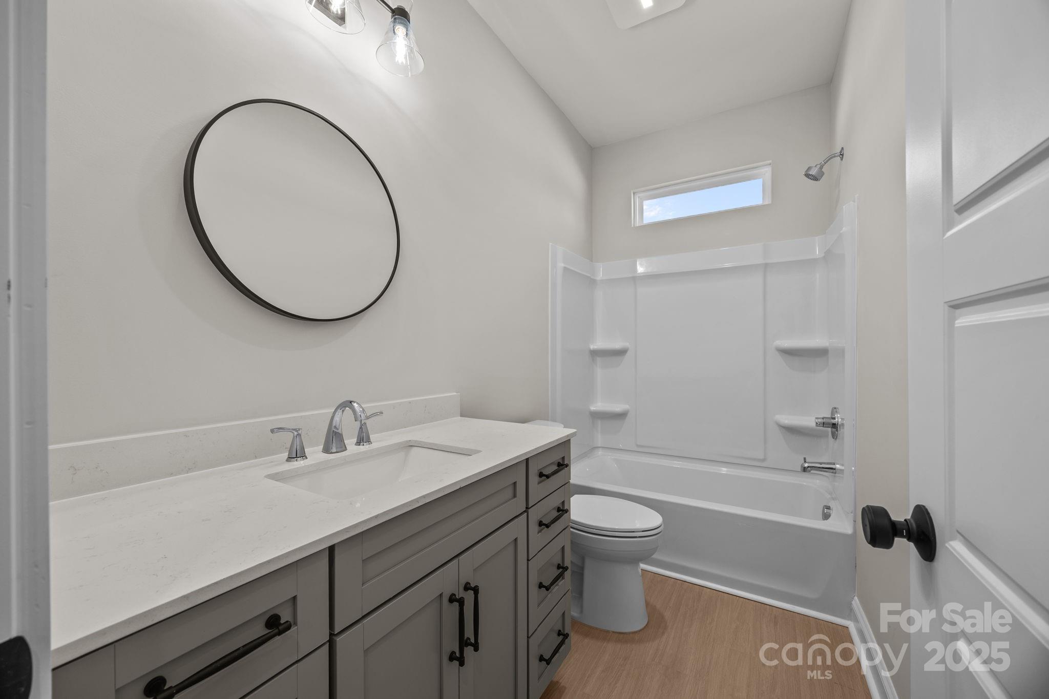 2295 Lee Lawing Road Lincolnton, NC 28092 - Photo 34 of 46 a bathroom with a sink a toilet and a mirror