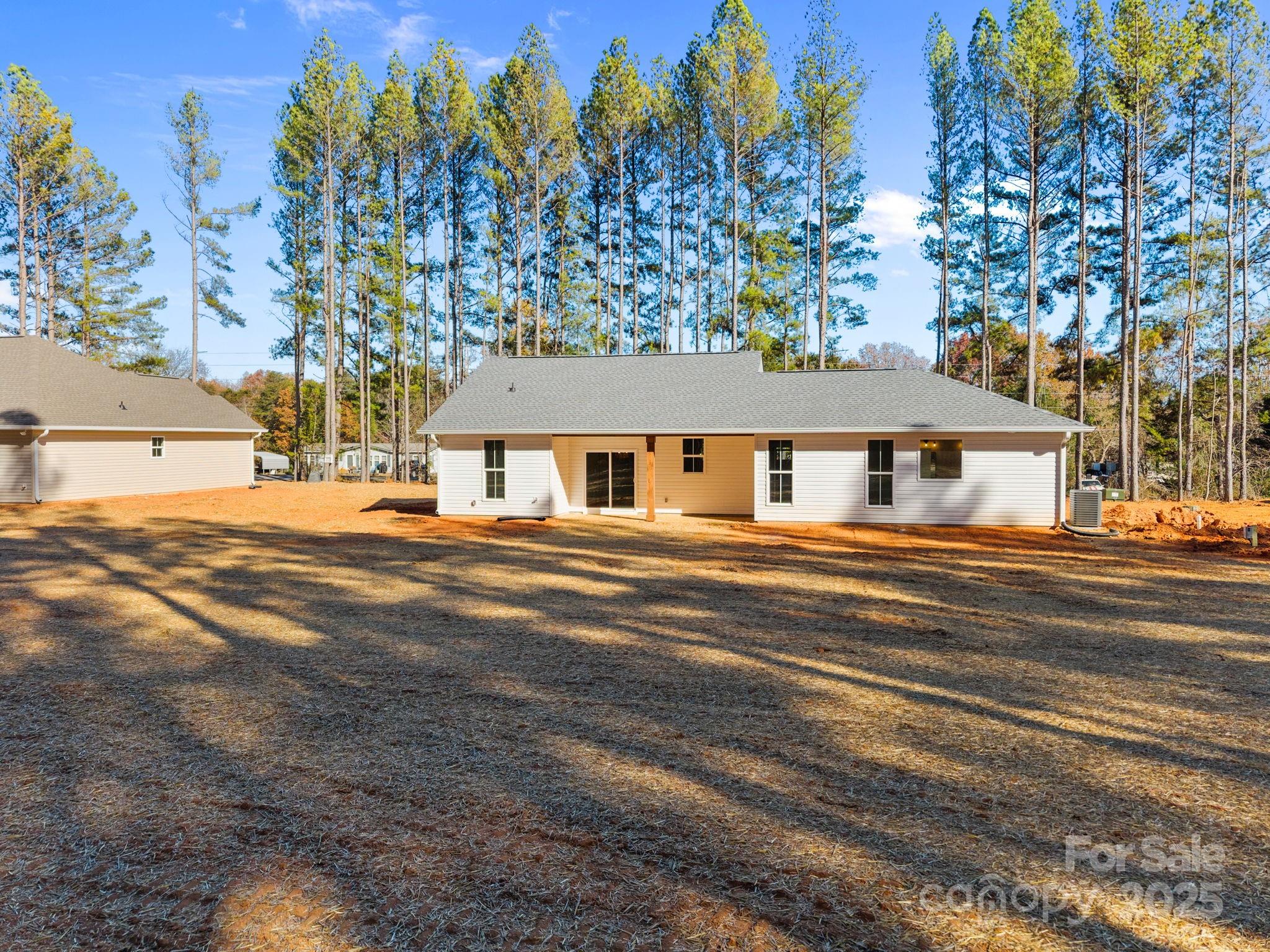 2295 Lee Lawing Road Lincolnton, NC 28092 - Photo 38 of 46 a front view of a house with a yard