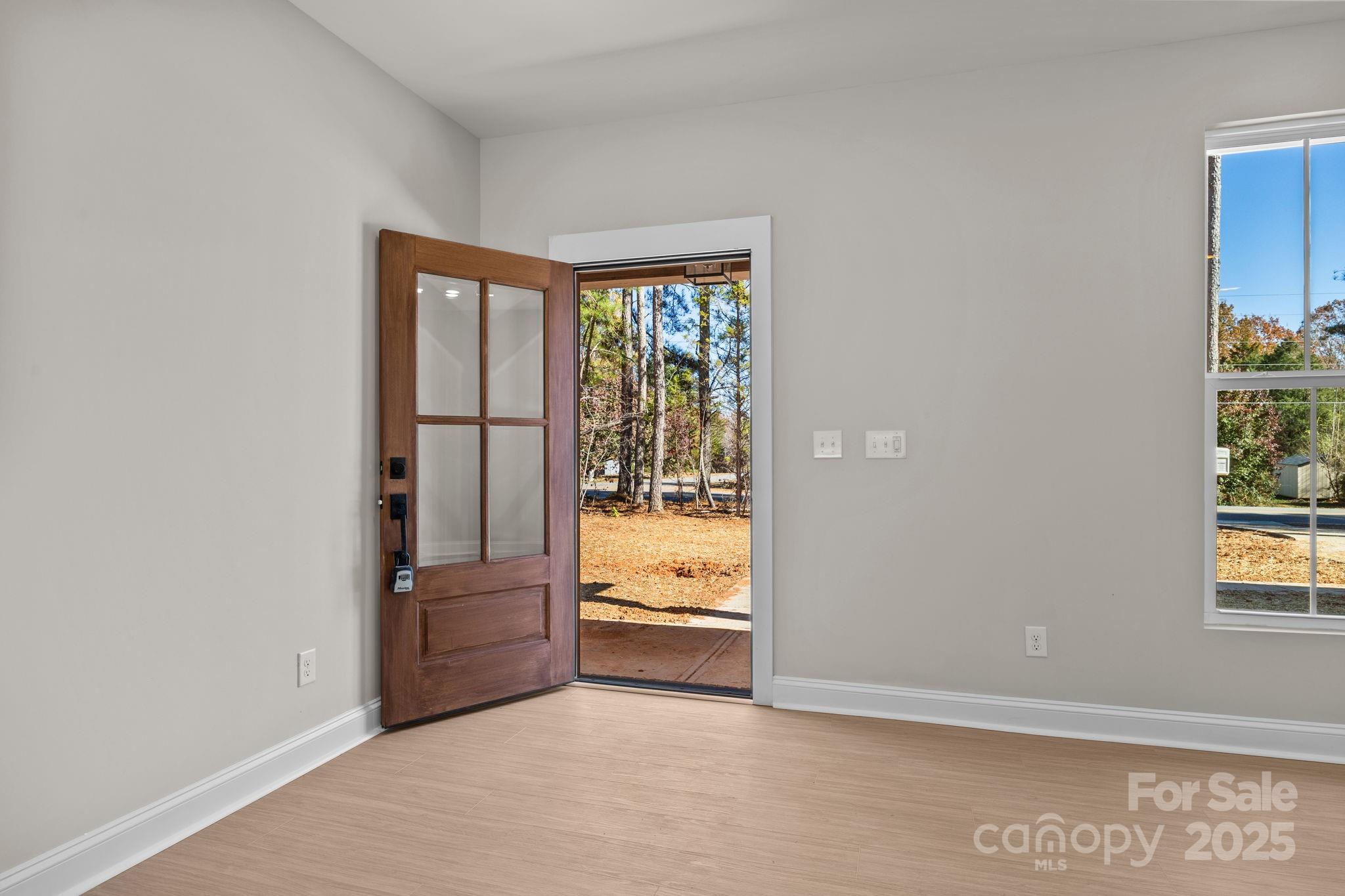 2295 Lee Lawing Road Lincolnton, NC 28092 - Photo 9 of 46 an empty room with windows