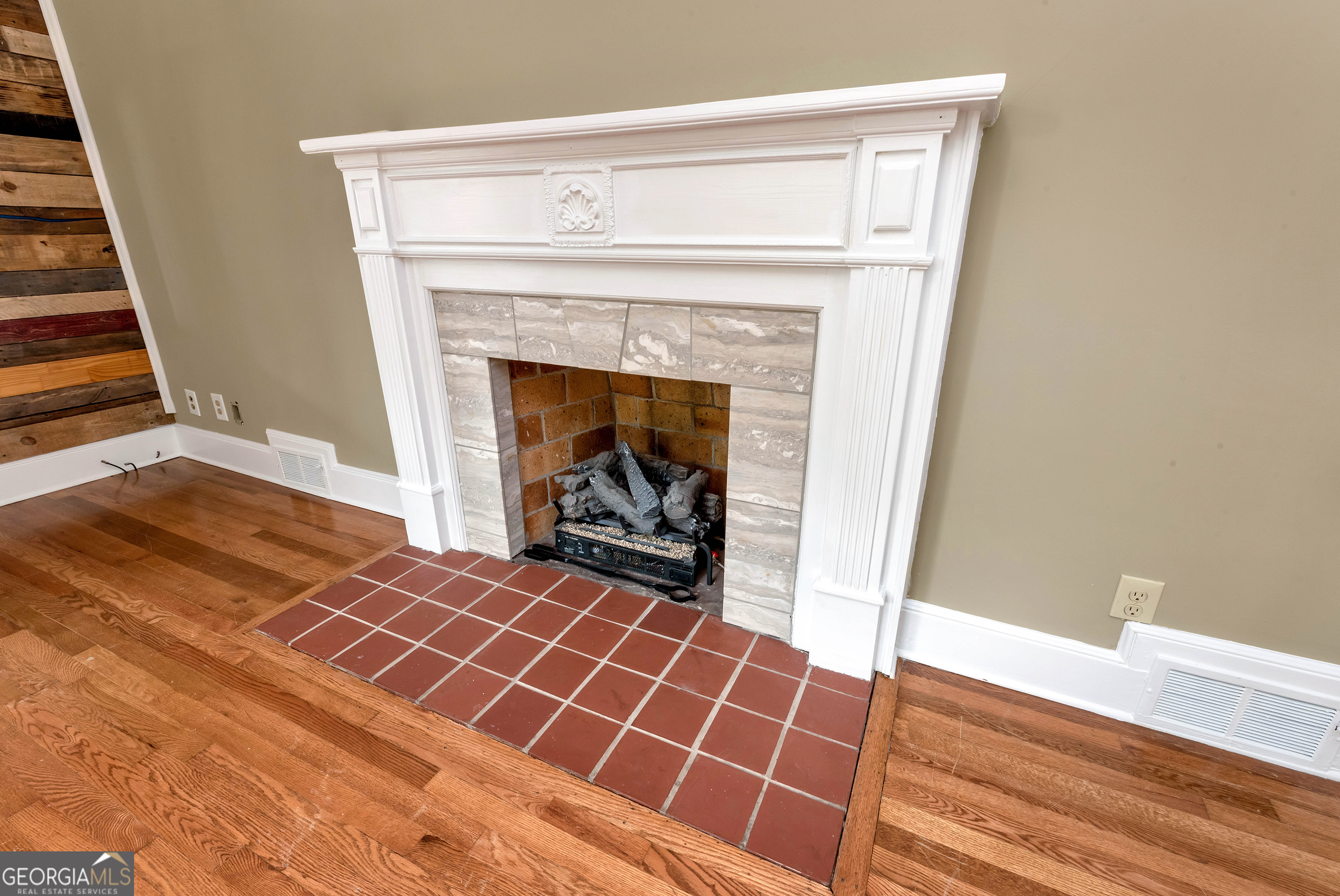 952 Wayside Street Northwest Cornelia, GA 30531 - Photo 17 of 70 a view of a livingroom with wooden floor and a fireplace