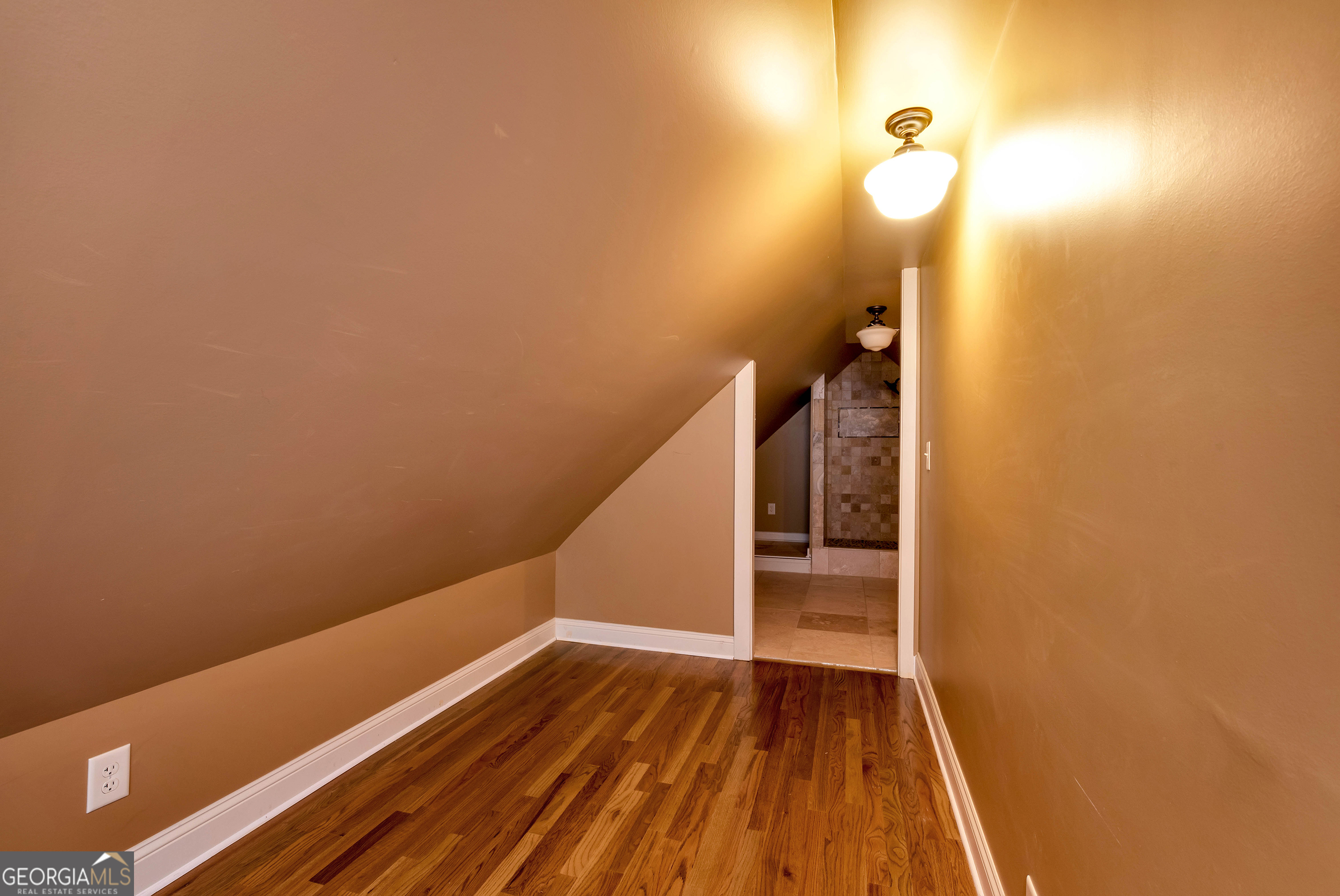 952 Wayside Street Northwest Cornelia, GA 30531 - Photo 46 of 70 a view of a room with wooden floor and white walls
