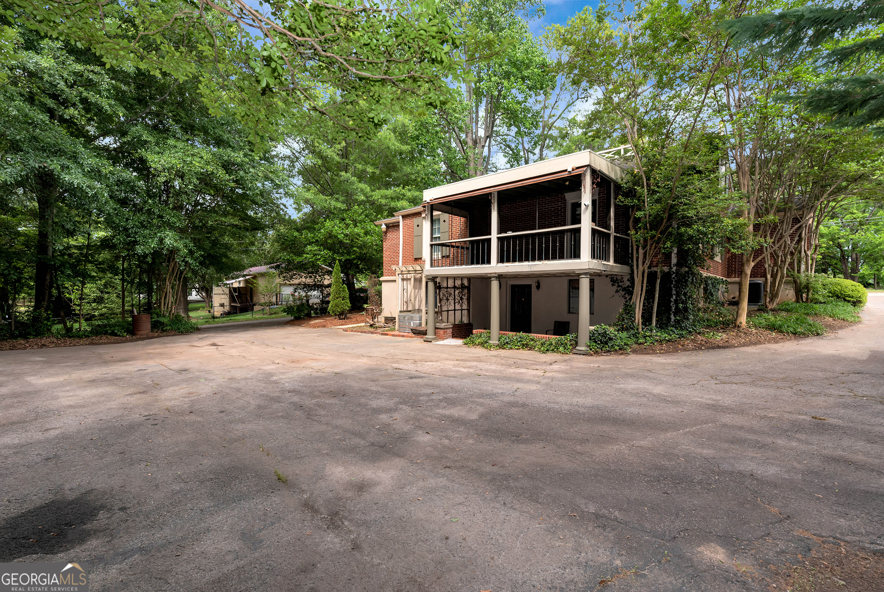 952 Wayside Street Northwest Cornelia, GA 30531 - Photo 49 of 70 a view of a house with a yard and large trees