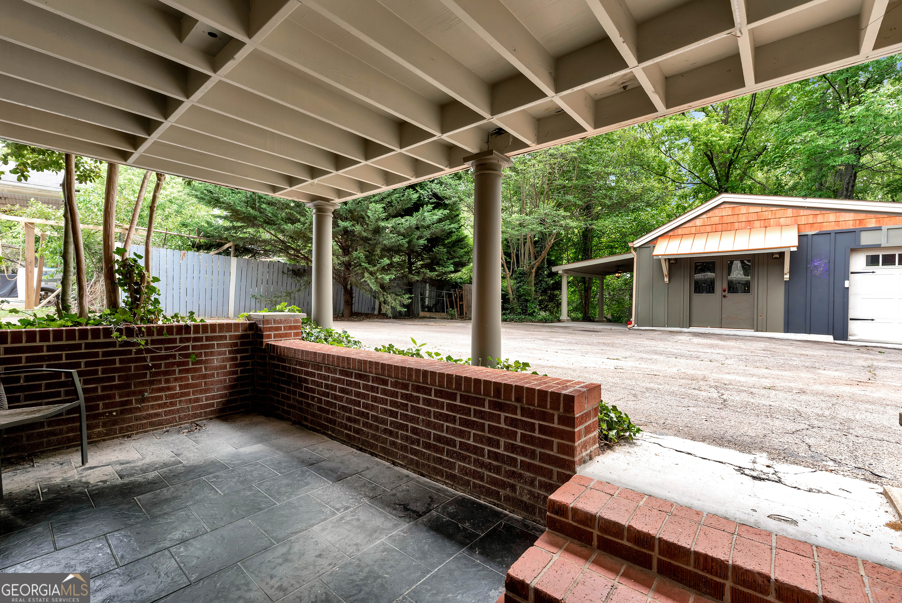 952 Wayside Street Northwest Cornelia, GA 30531 - Photo 50 of 70 a view of a patio with table and chairs and wooden fence