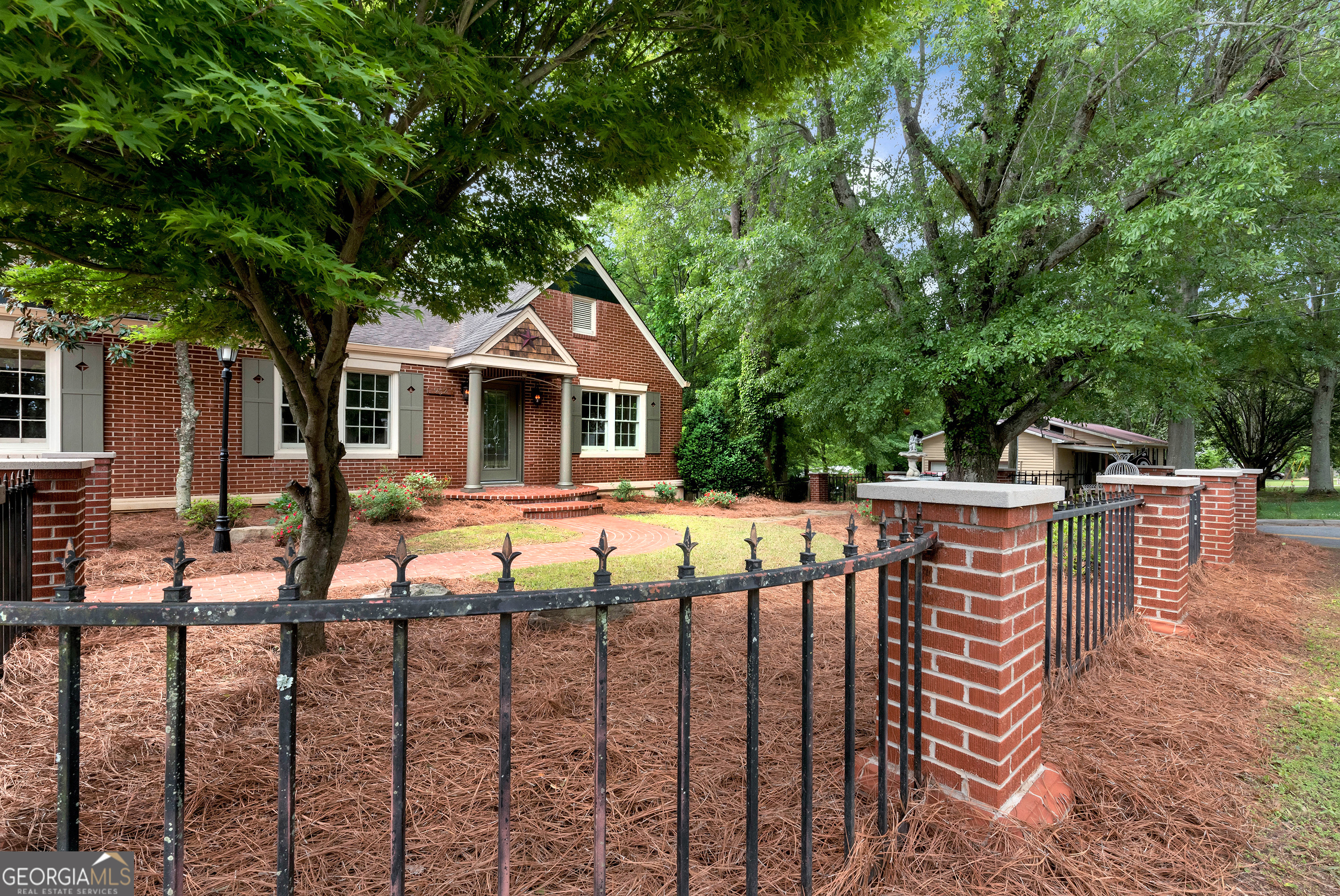 952 Wayside Street Northwest Cornelia, GA 30531 - Photo 62 of 70 a view of a house with wooden deck and a trees