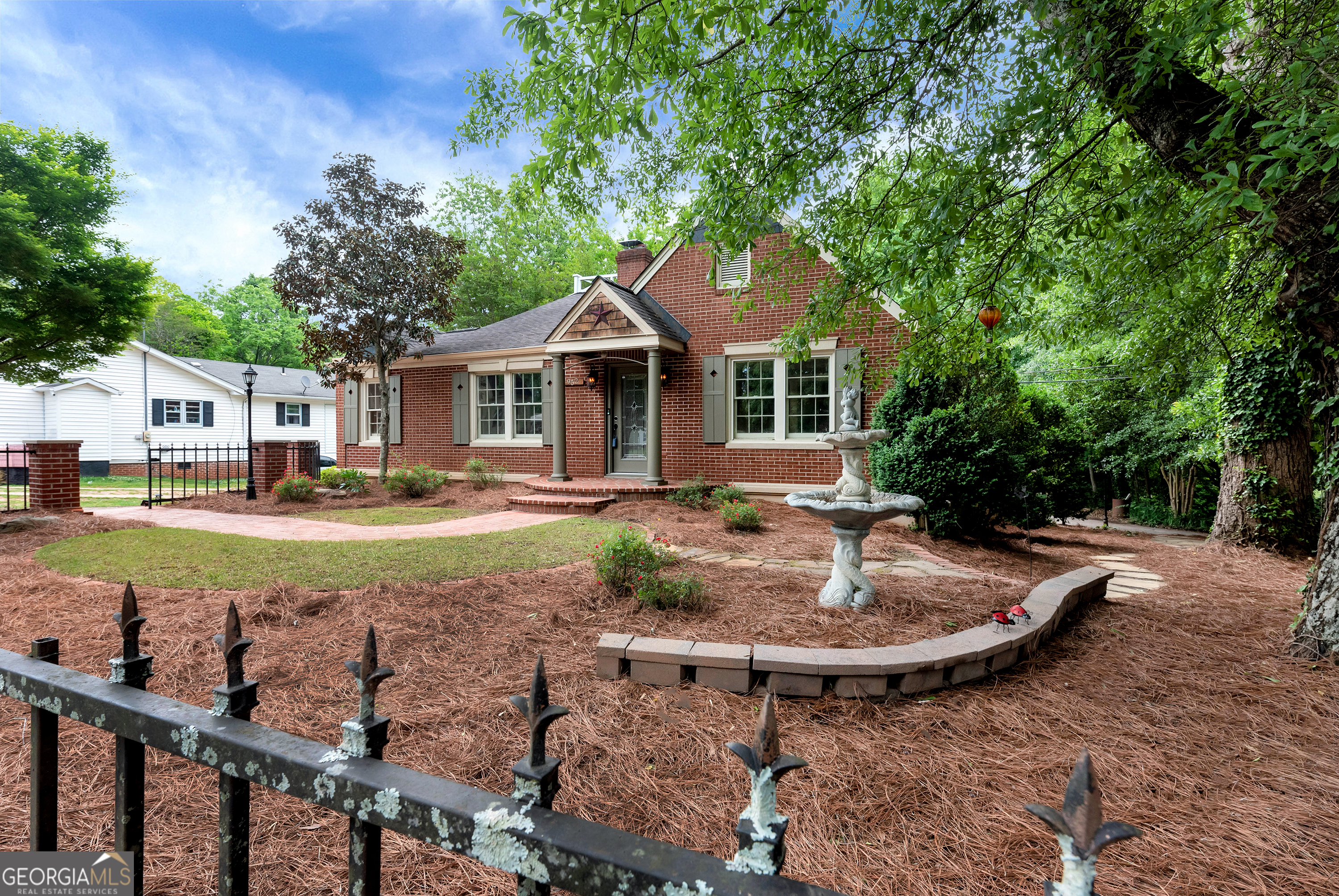 952 Wayside Street Northwest Cornelia, GA 30531 - Photo 64 of 70 a view of a house with backyard and trees