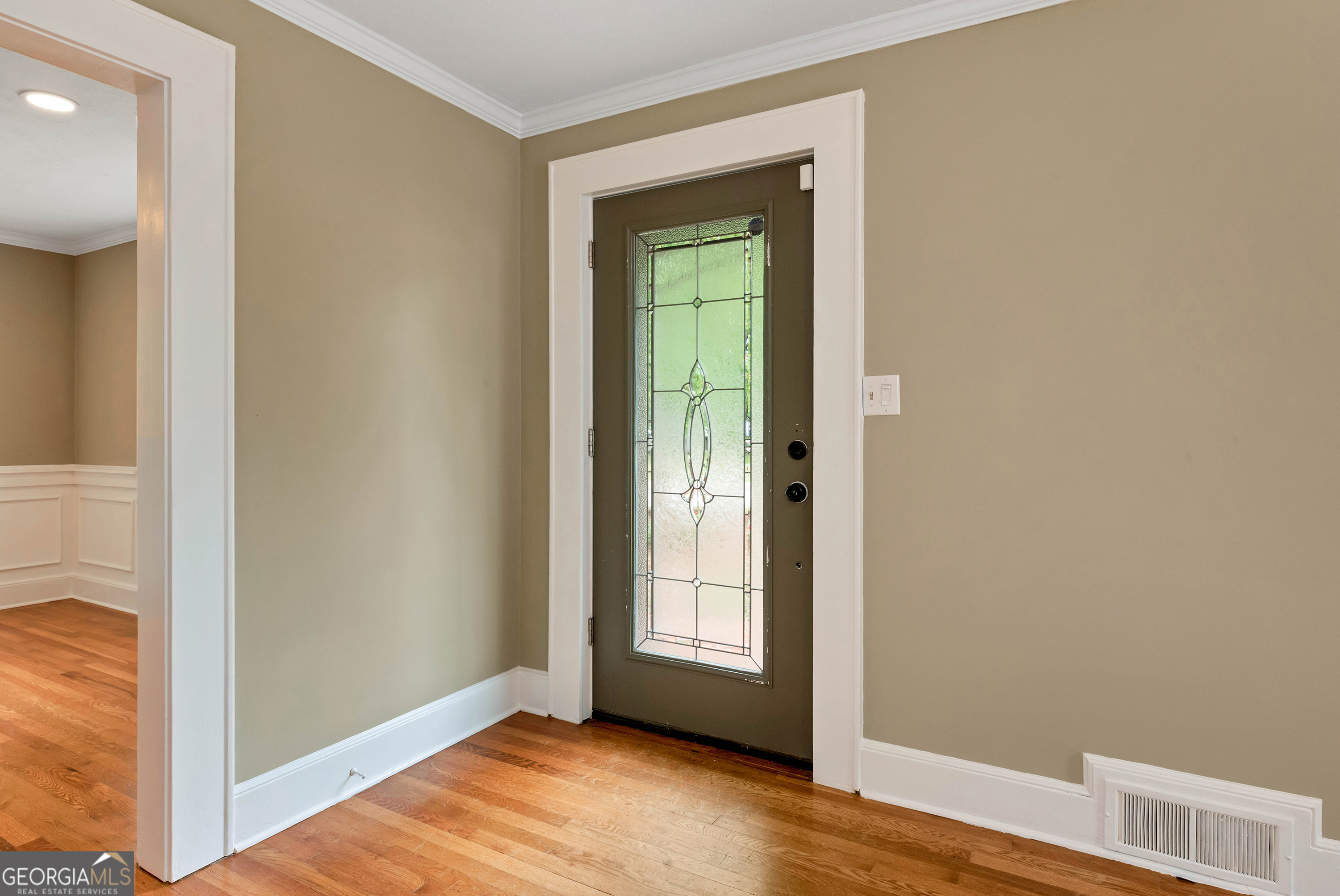 952 Wayside Street Northwest Cornelia, GA 30531 - Photo 7 of 70 a view of an empty room with wooden floor and a window