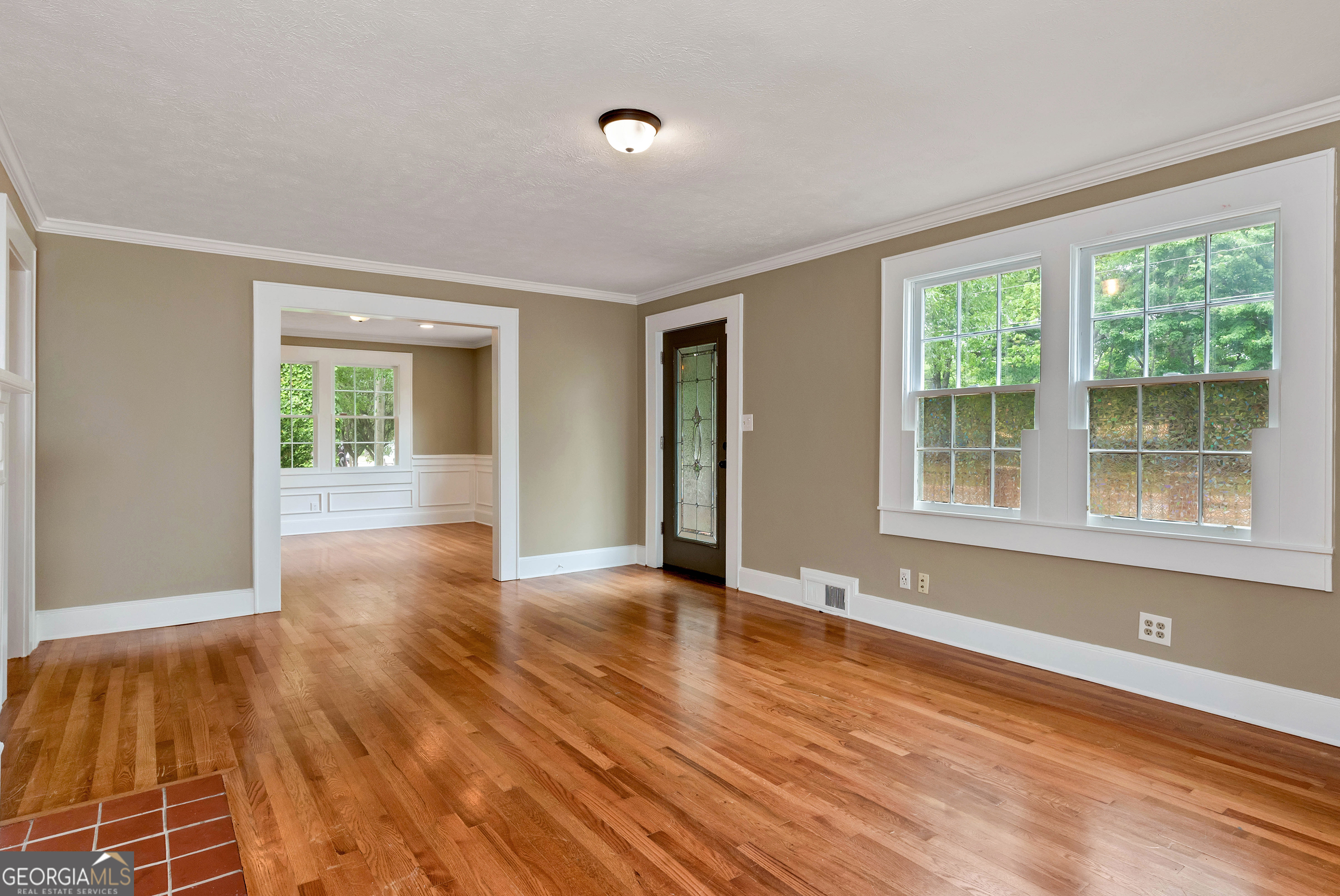 952 Wayside Street Northwest Cornelia, GA 30531 - Photo 8 of 70 a view of an empty room with wooden floor and a window