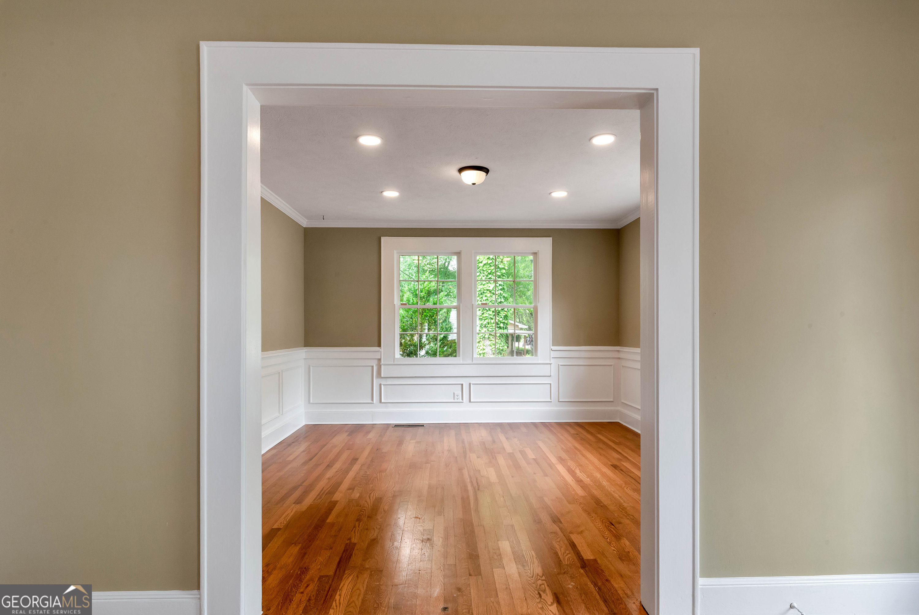 952 Wayside Street Northwest Cornelia, GA 30531 - Photo 10 of 70 a view of an empty room with wooden floor and a window
