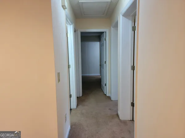 a view of a hallway with closet