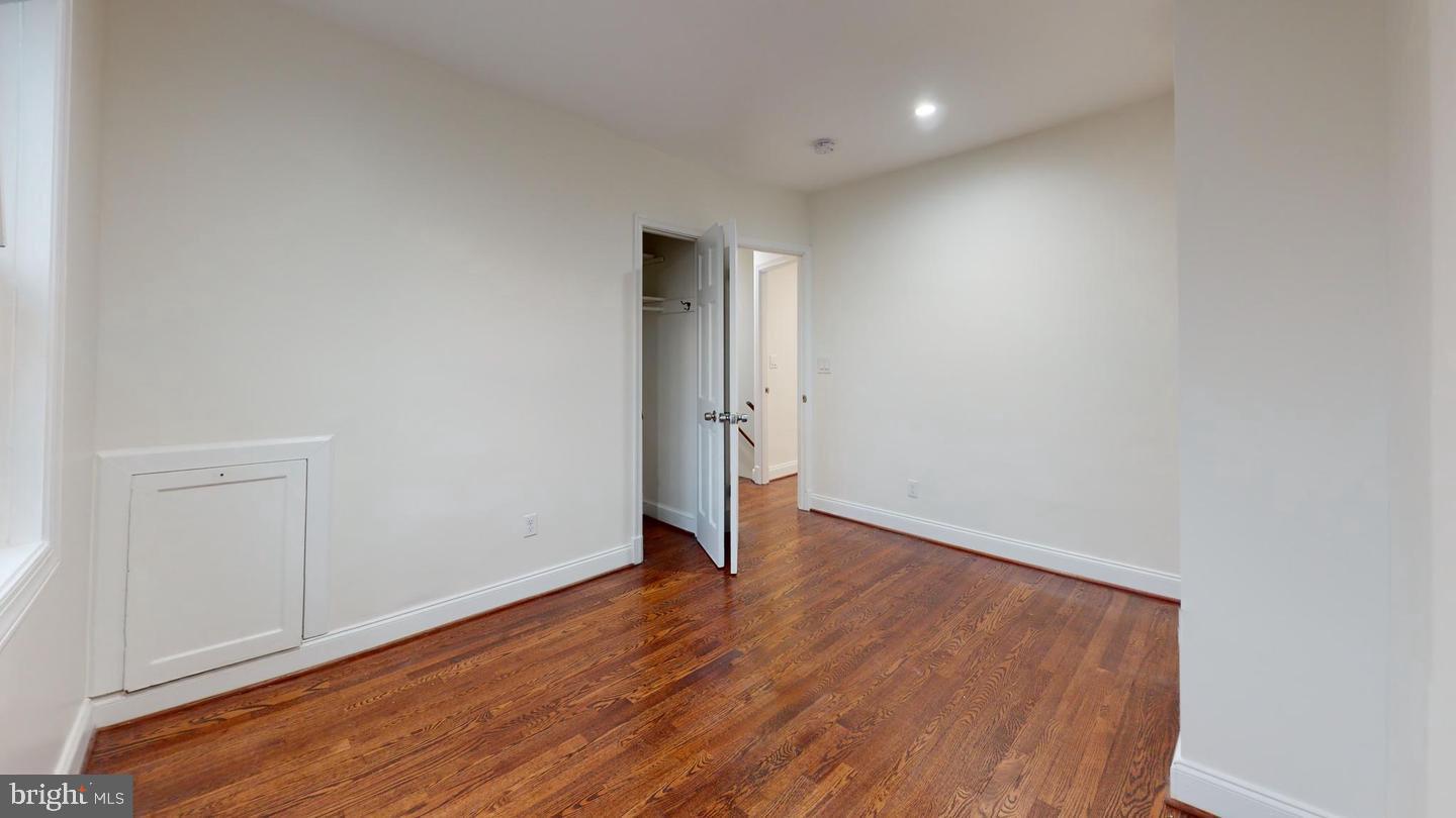1622 Ridge Place Southeast Washington, DC 20020 - Photo 12 of 27 an empty room with wooden floor and closet
