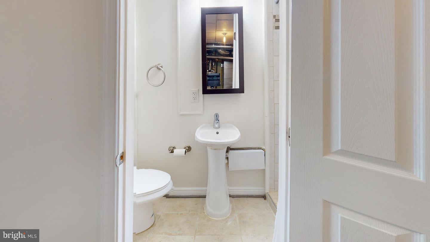 1622 Ridge Place Southeast Washington, DC 20020 - Photo 13 of 27 a bathroom with a toilet sink and shower