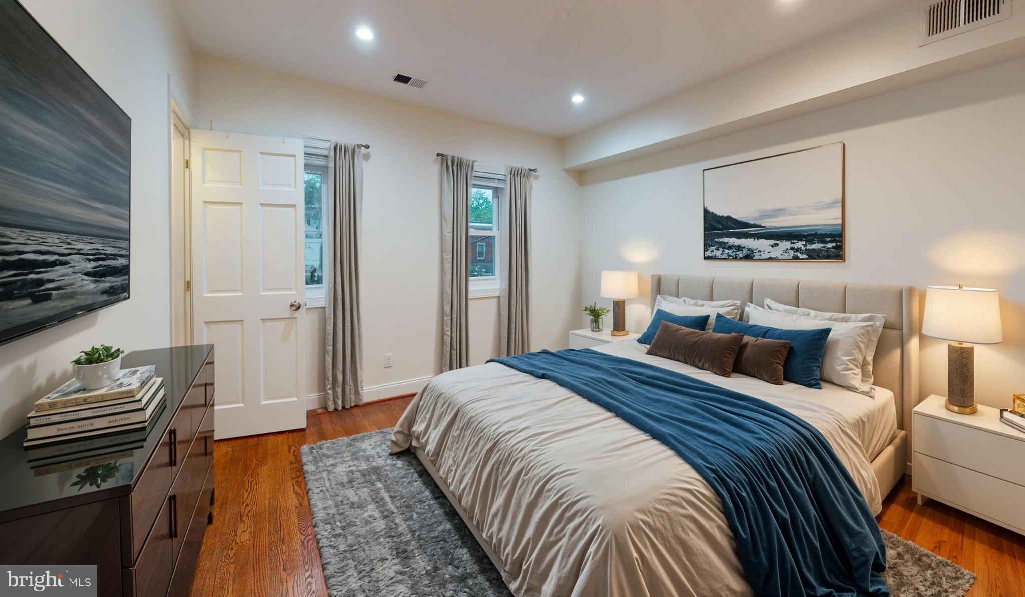 1622 Ridge Place Southeast Washington, DC 20020 - Photo 5 of 27 a bedroom with a bed and a lamp