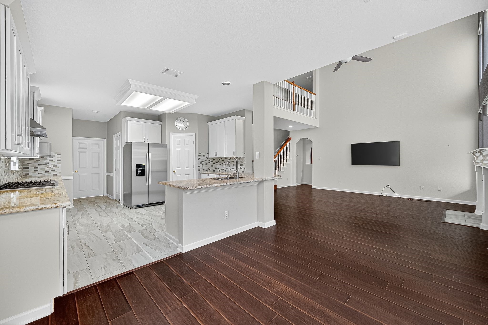 22406 Piper Terrace Lane Katy, TX 77450 - Photo 19 of 44 a view of kitchen with cabinets and wooden floor