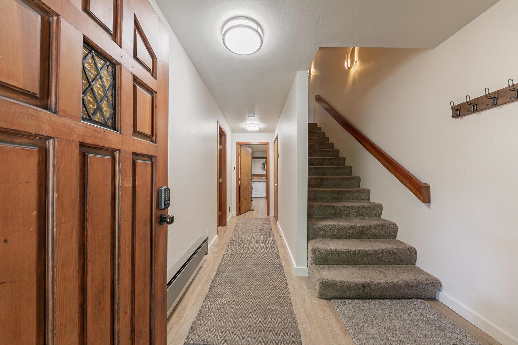 3003 Meadow Court, Unit 5 Olympic Valley, CA 96146 - Photo 16 of 28 a view of staircase with lots of frames on wall and a window