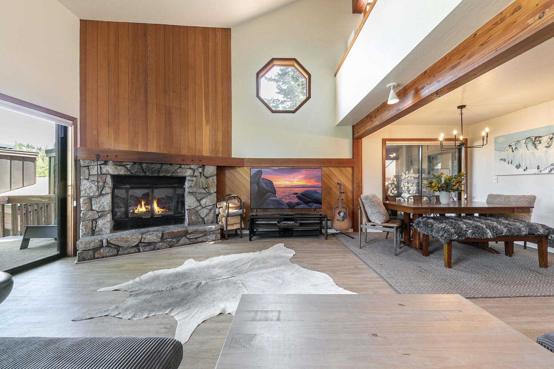 3003 Meadow Court, Unit 5 Olympic Valley, CA 96146 - Photo 6 of 28 a living room with furniture a clock and a fireplace