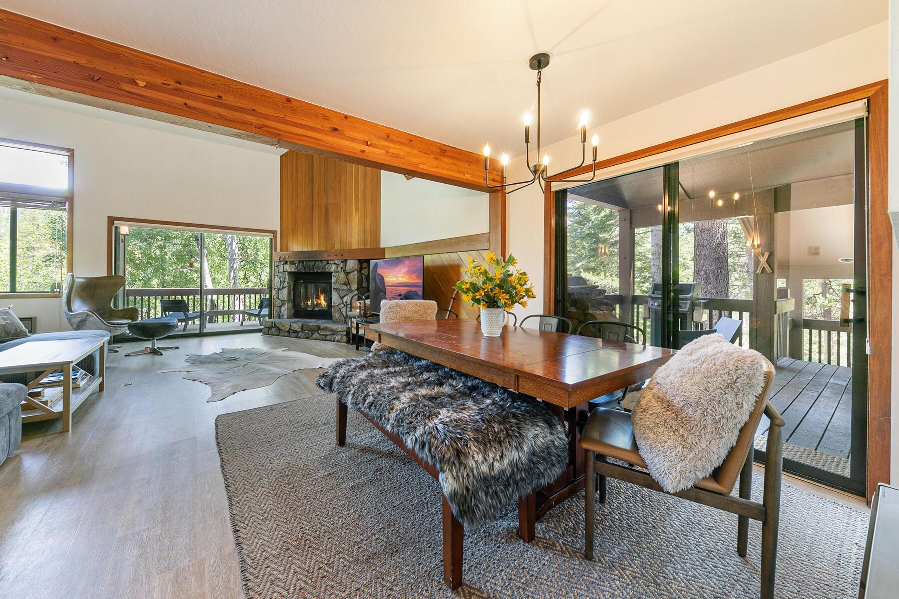 3003 Meadow Court, Unit 5 Olympic Valley, CA 96146 - Photo 7 of 28 a living room with furniture a table and large windows