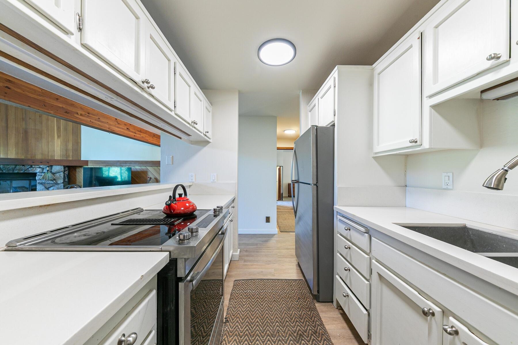3003 Meadow Court, Unit 5 Olympic Valley, CA 96146 - Photo 8 of 28 a kitchen that has a sink and a stove