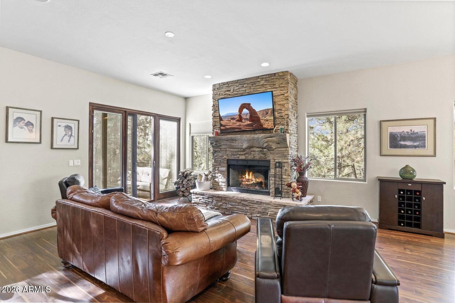 415 East Rim Estates Trail Payson, AZ 85541 - Photo 13 of 76 a living room with furniture a window and a fireplace