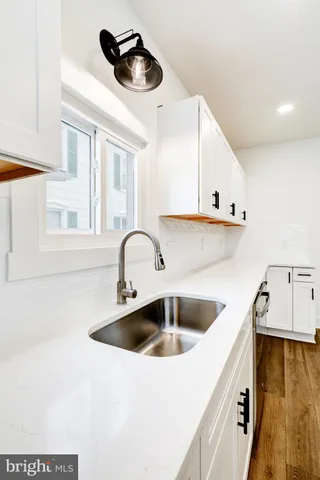 a kitchen with a sink and cabinets