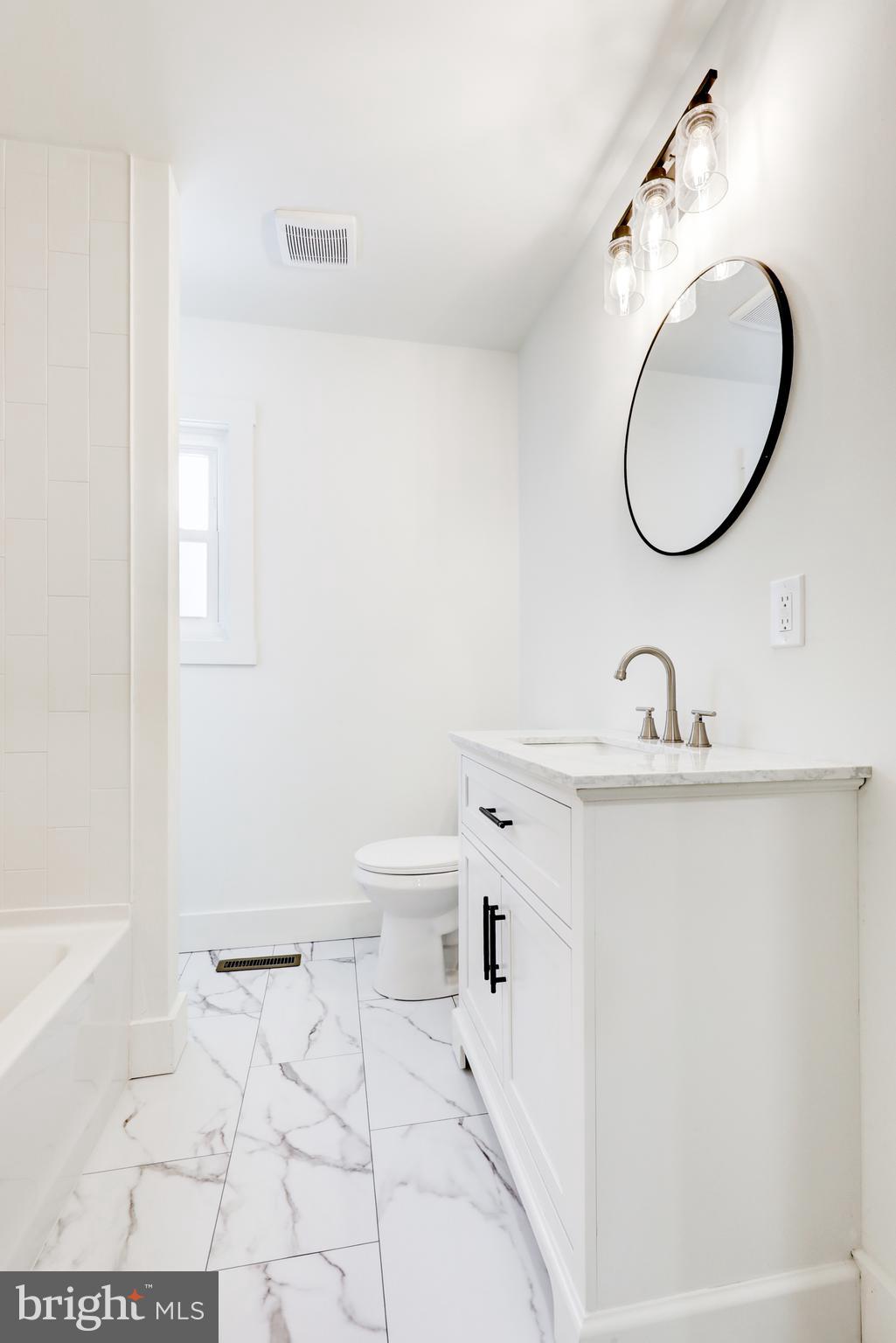 711 Main Street Lykens, PA 17048 - Photo 20 of 38 a bathroom with a sink a toilet and a mirror