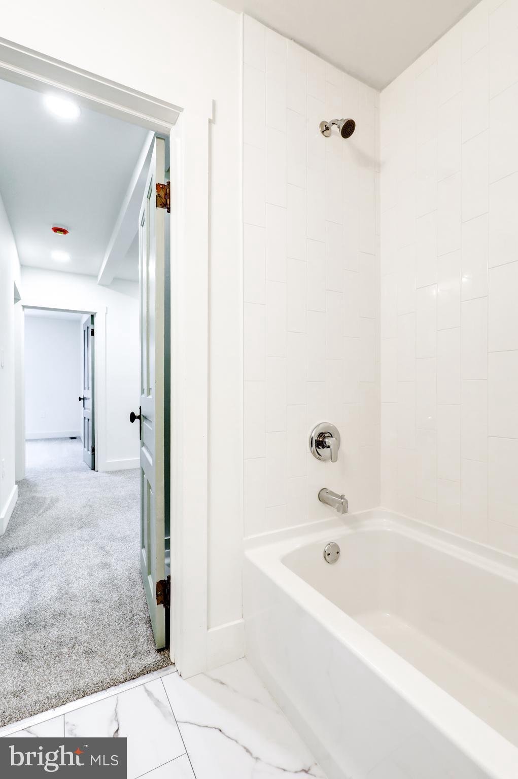 711 Main Street Lykens, PA 17048 - Photo 21 of 38 a bathroom with a bathtub and shower