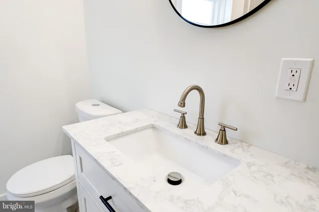 a bathroom with a sink and a toilet