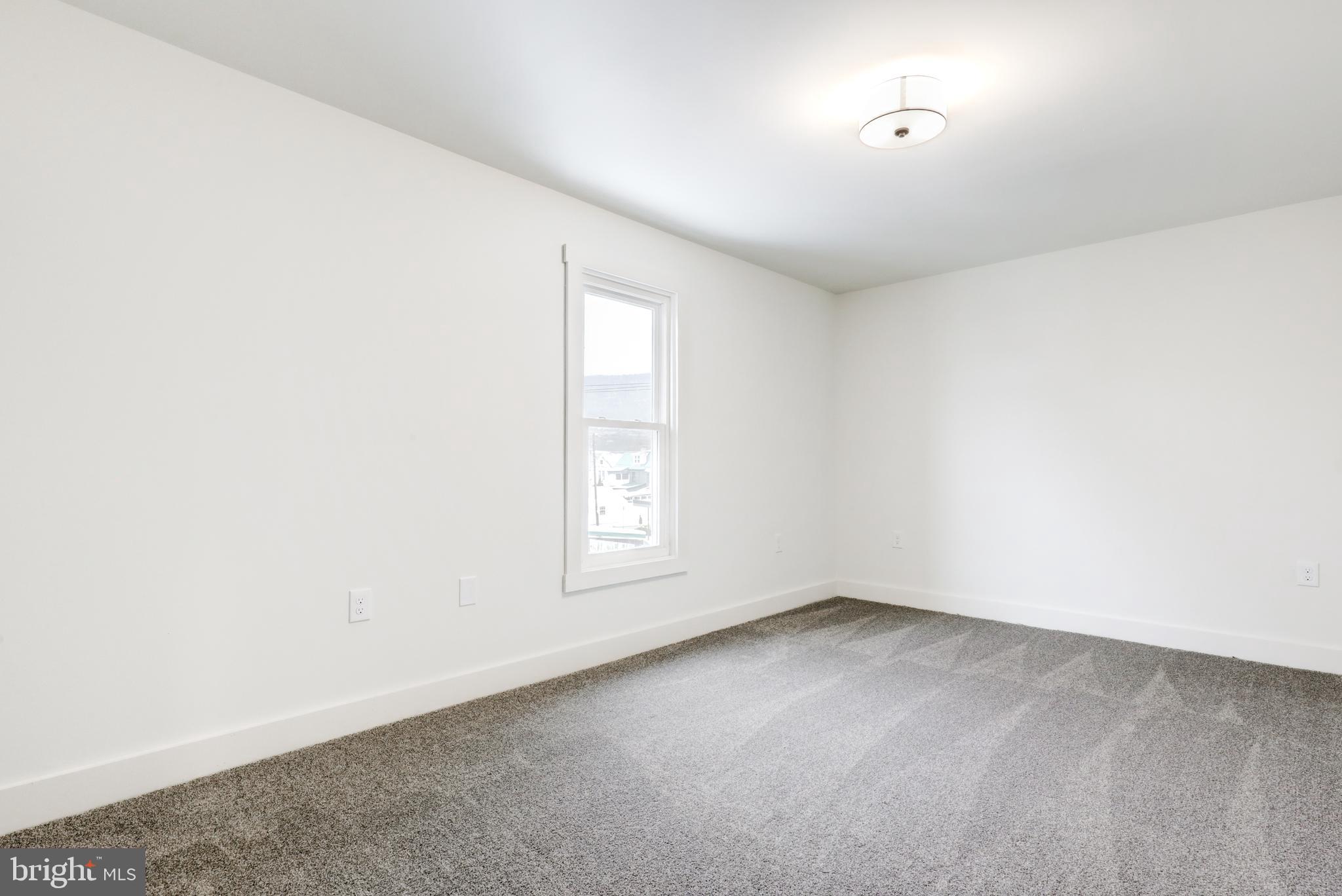 711 Main Street Lykens, PA 17048 - Photo 23 of 38 an empty room with a window