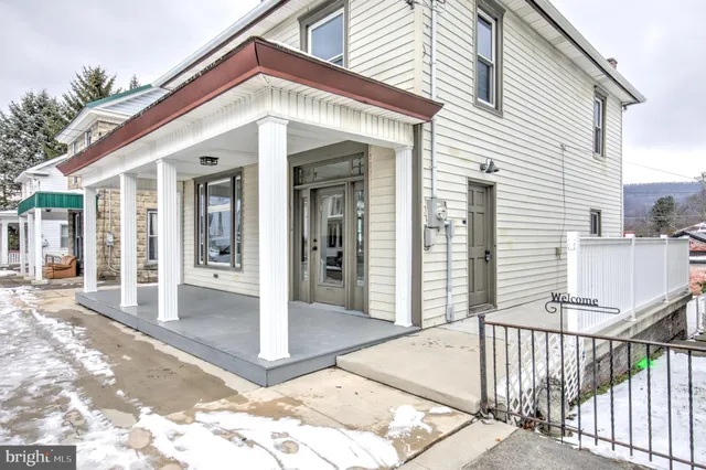 a front view of a house with a porch