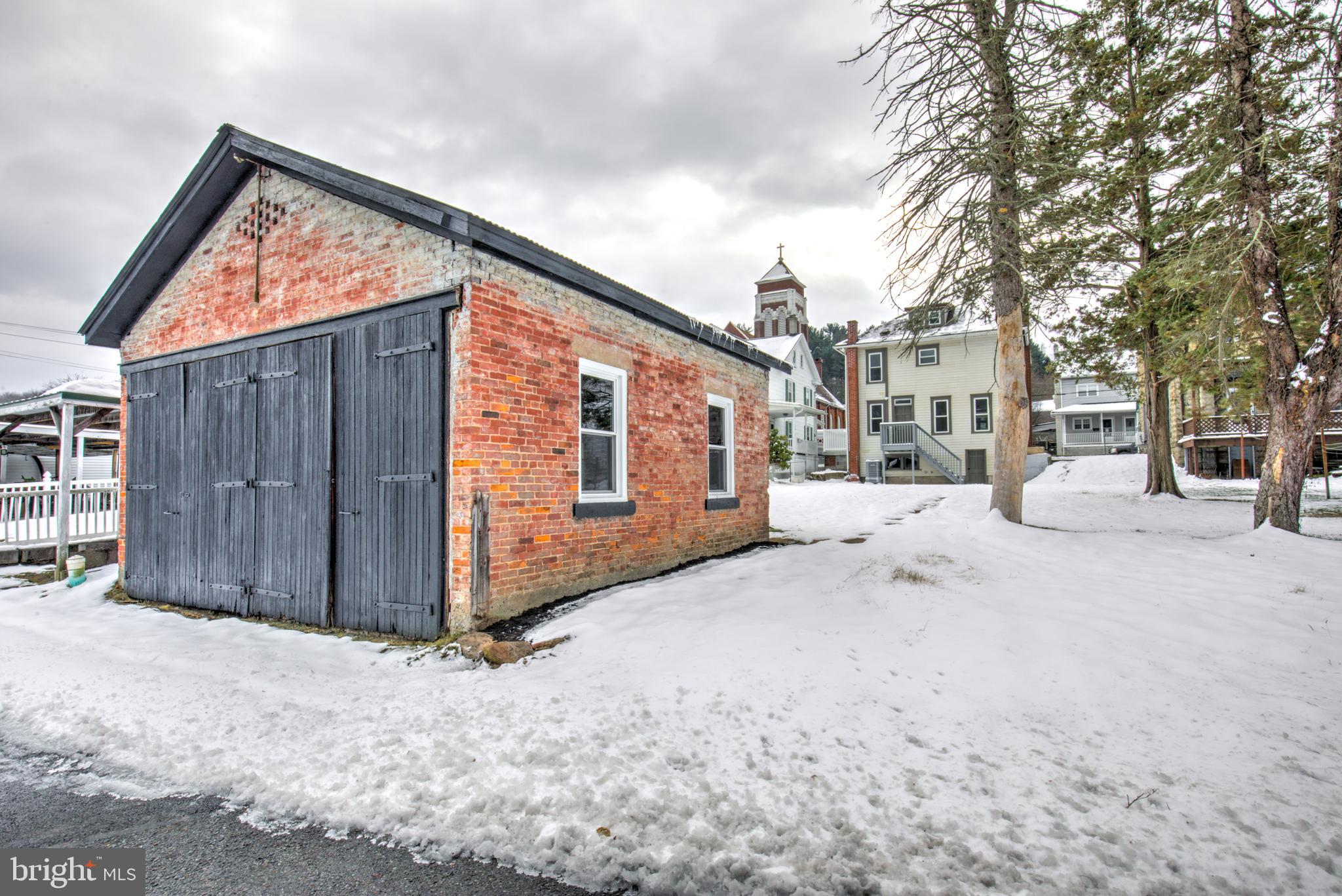 711 Main Street Lykens, PA 17048 - Photo 37 of 38 a view of a house with a snow in the yard